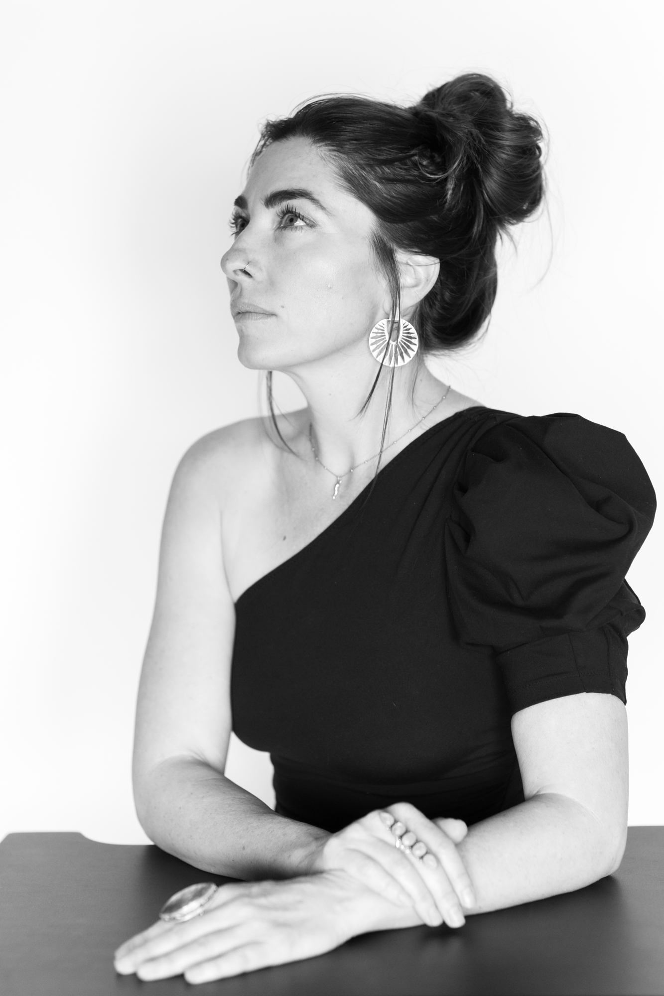 Regal headshot of beautiful woman seating with crossed arms in just be self love portrait session in Oceano CA portrait studio.