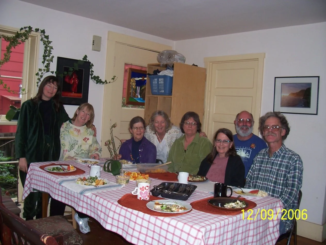 Picture of our first 8 members elected to the BACLT board after incorporating. They are sitting at a dinner table and posing for the camera. Picture is dated 12/9/2006 in the corner.