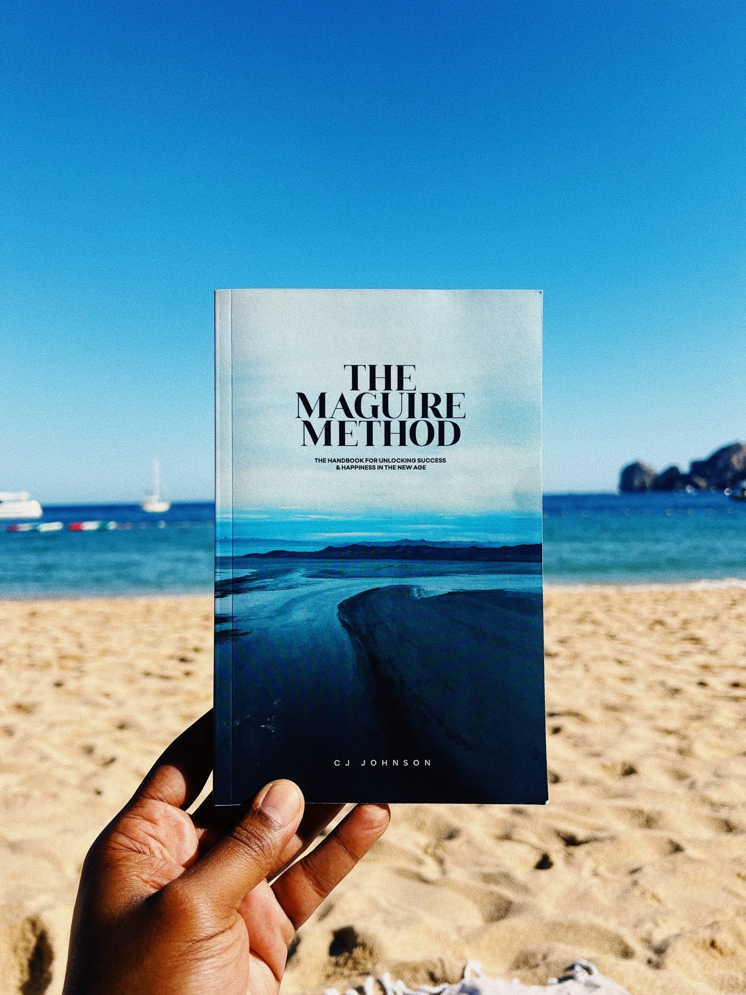 The Maguire Method by CJ Johnson held up at the beach