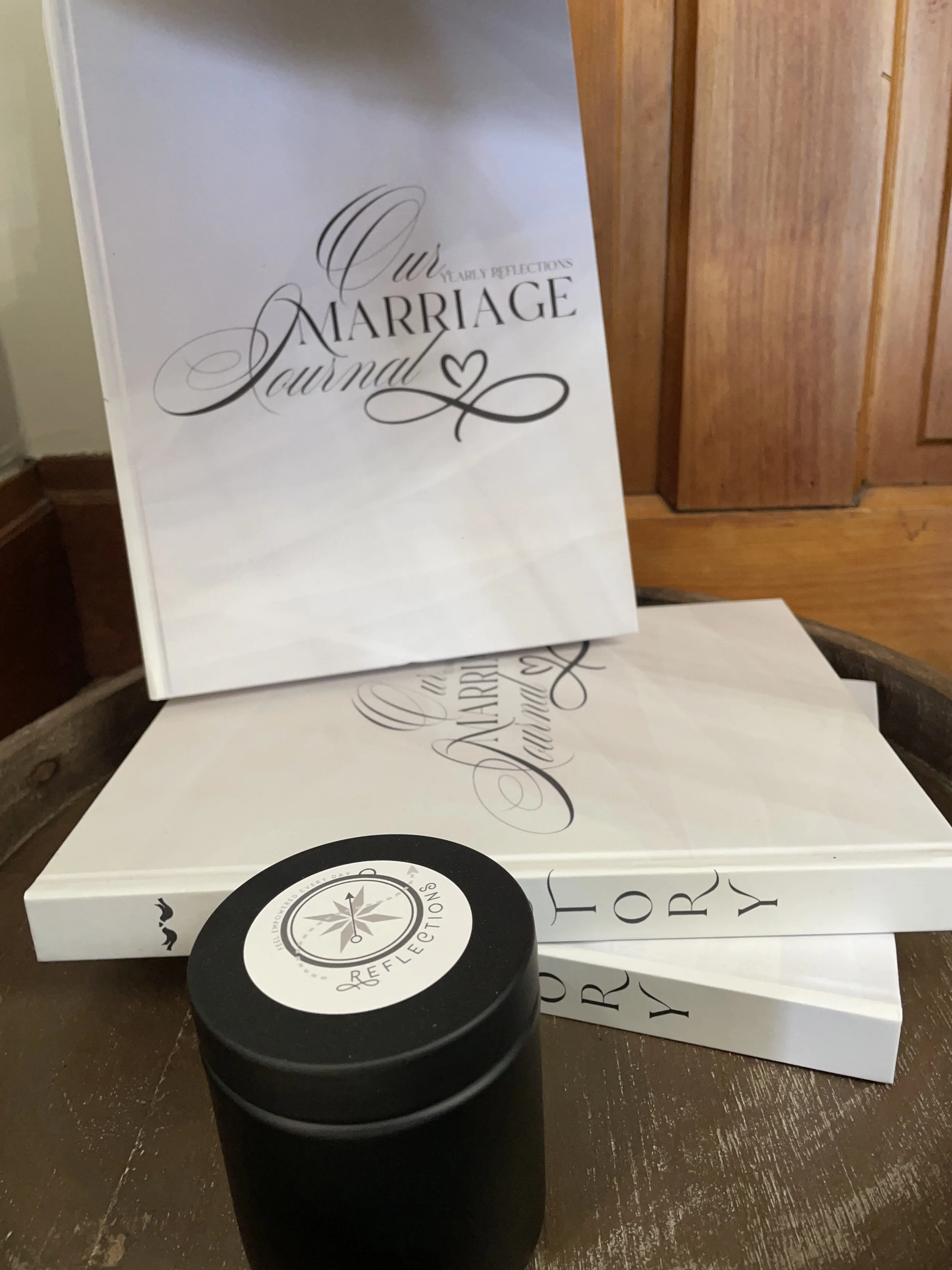 our marriage journal book on a stand with a candle