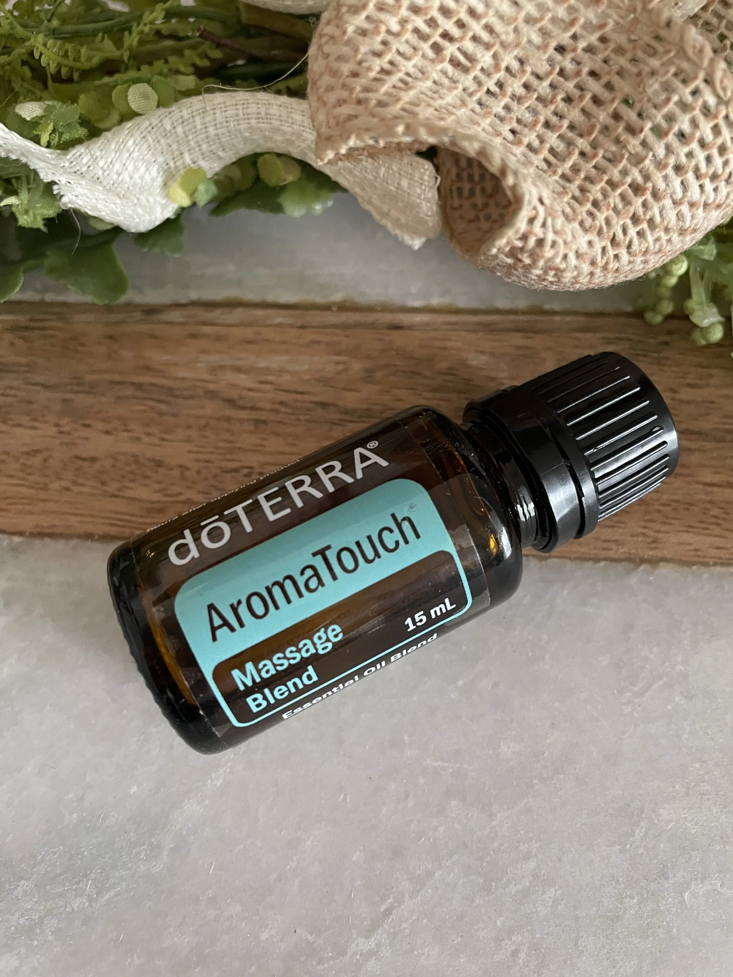 bottle of doTERRA aromatouch massage blend