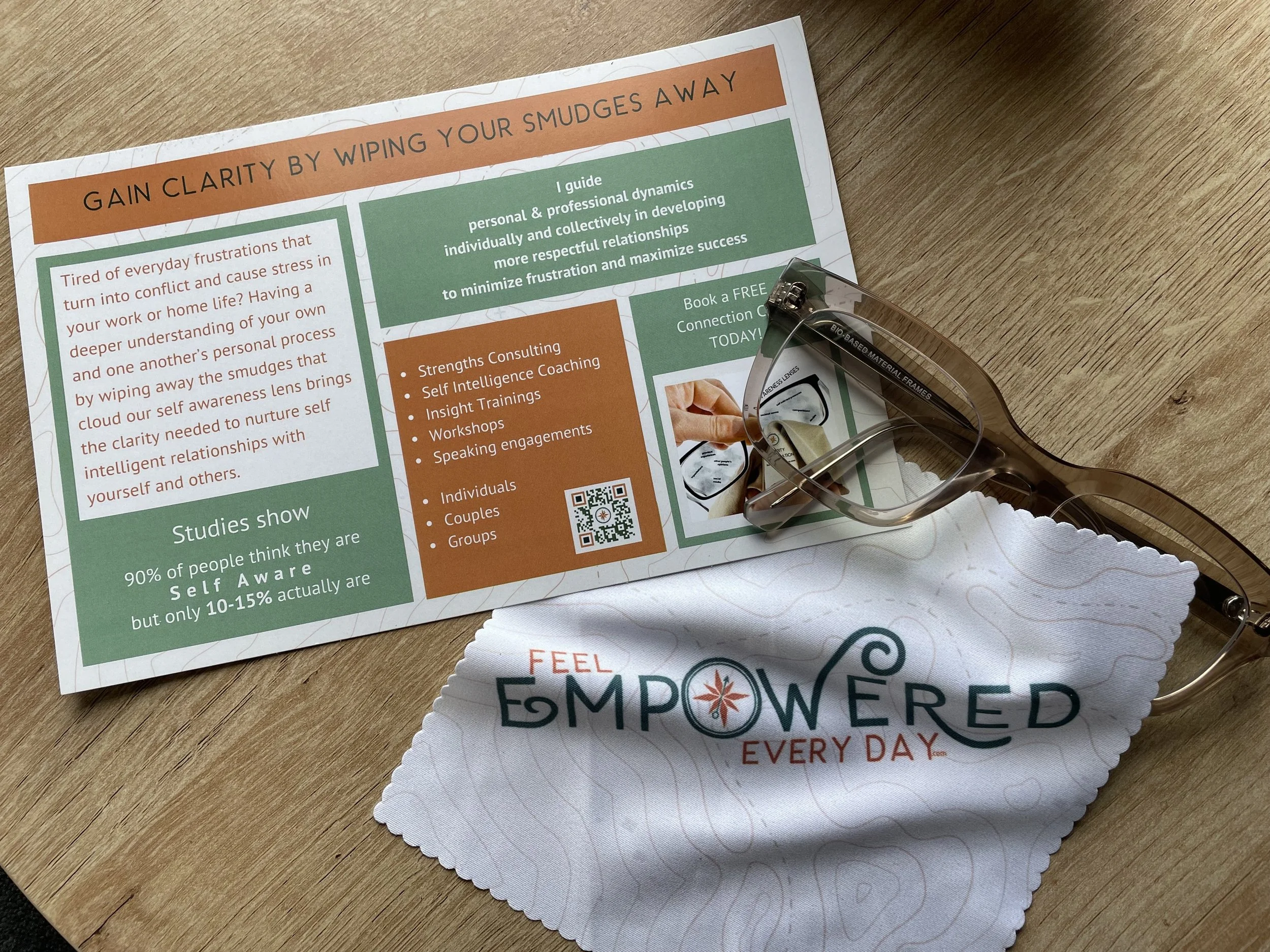 a promotional card for feel empowered every day talking about gain clarity by wiping your smudges away with glasses and a branded lens cloth
