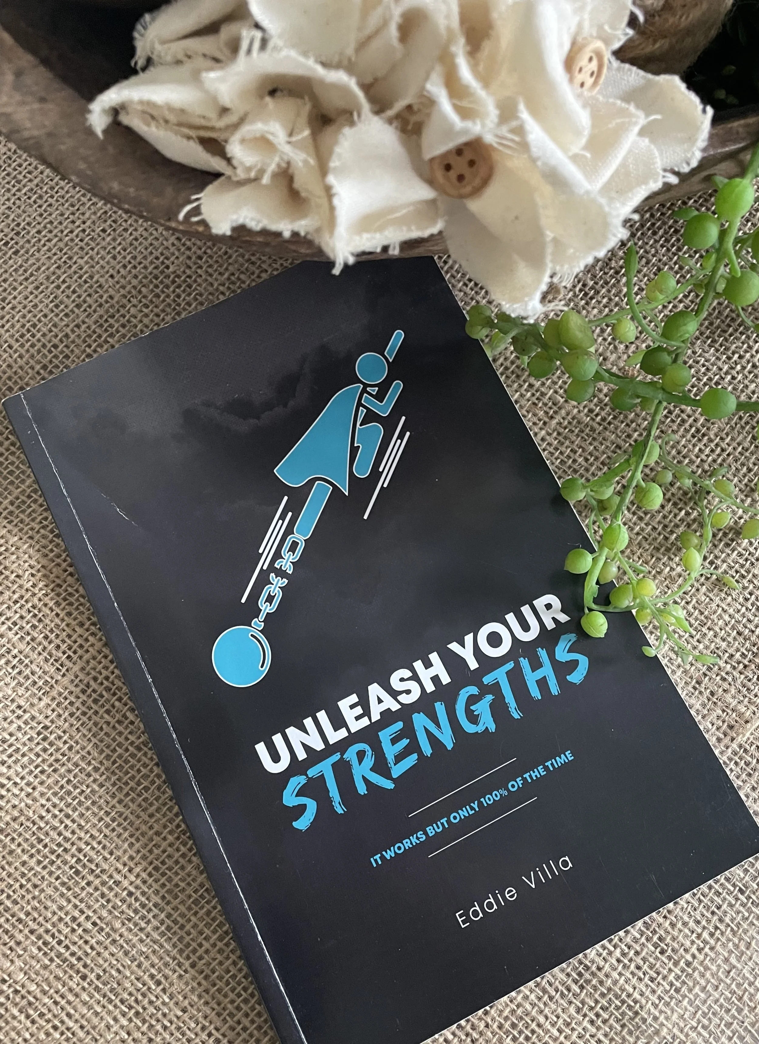 The book Unleash Your Strengths by Eddie Villa