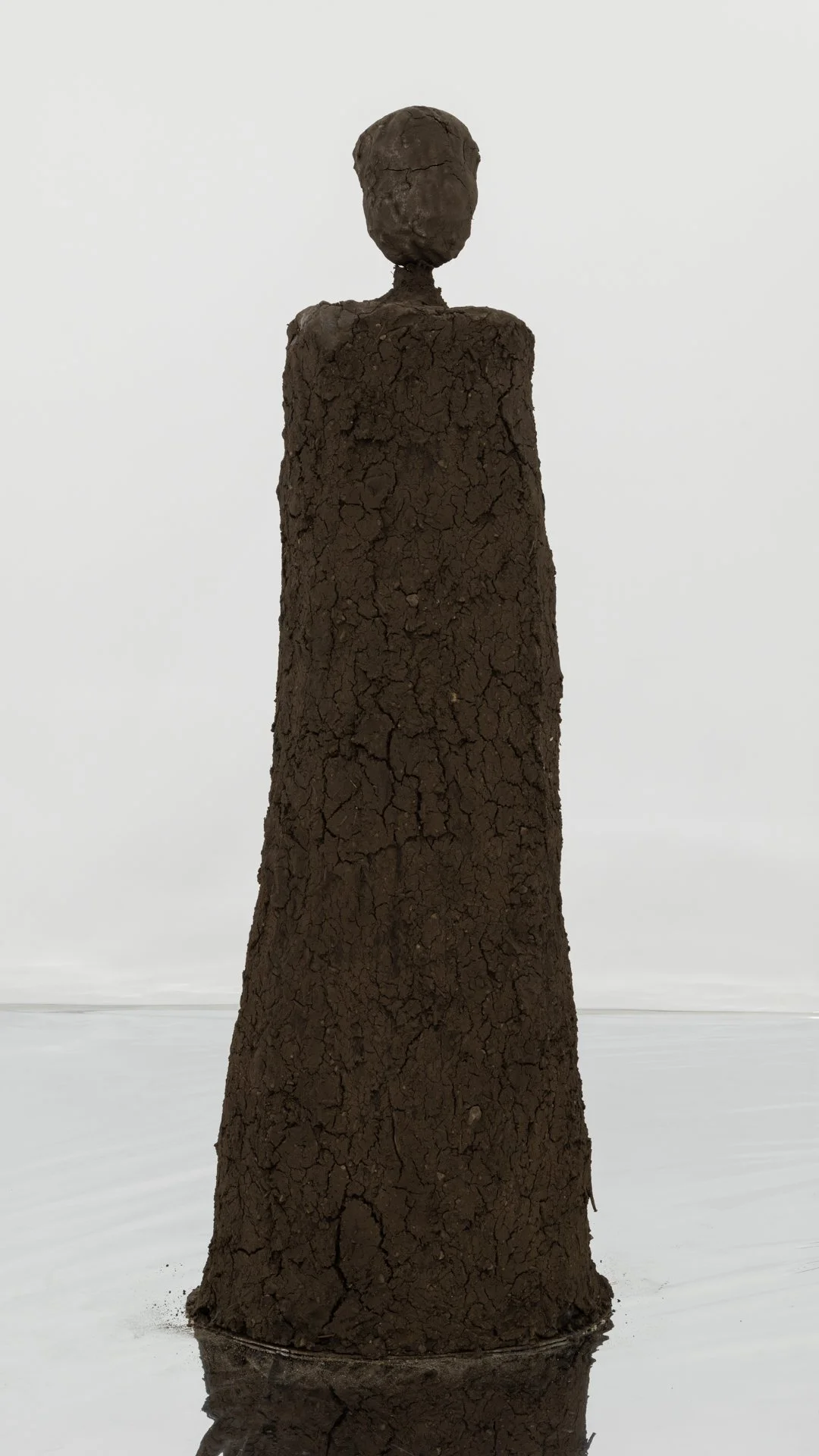 Kiyan Williams,  Sentient Ruin 6 , 2022, earth, binder, steel base and armature, 61 x 14 1/2 x 13 1/2 inches, 154.9 x 36.8 x 34.3 cm