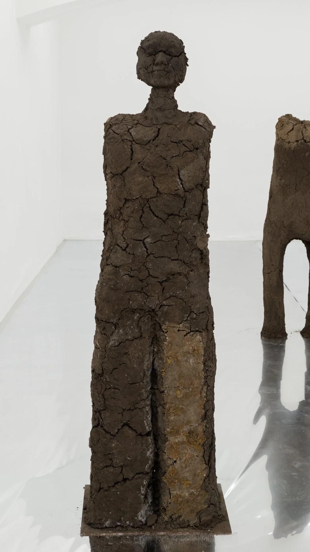 Kiyan Williams,  Sentient Ruin 1 , 2022, earth, moss, binder, steel base and armature, 72 x 22 1/2 x 16 inches, 182.9 x 57.1 x 40.6 cm 