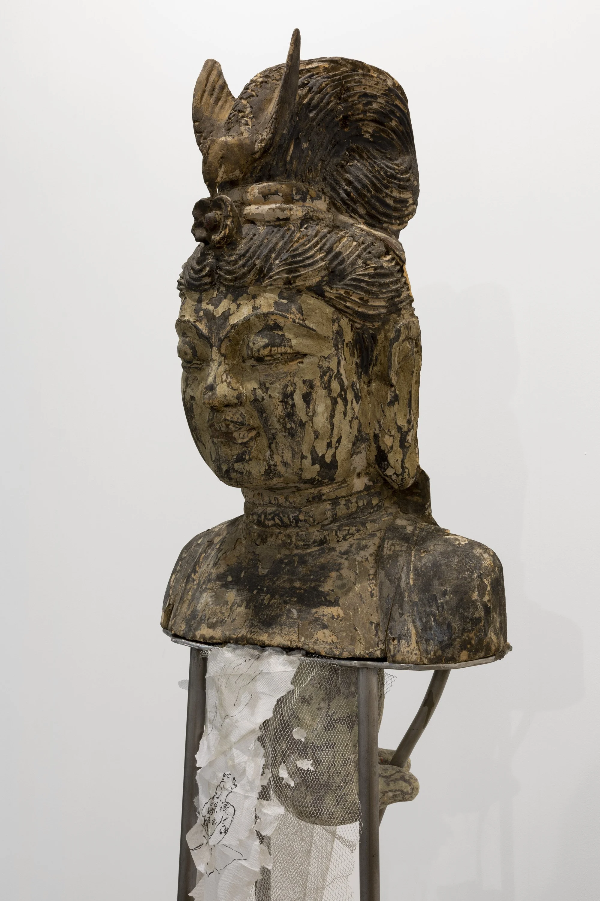  Martyr for Freedom (after Edmonia Lewis) , 2022, Wooden bust of Guan Yin, 19th century; steel, horse bone, wire mesh, napkins, ink, shellac, paper pulp, beeswax, wildflowers from the Acropolis, 72 x 16 x 12 inches