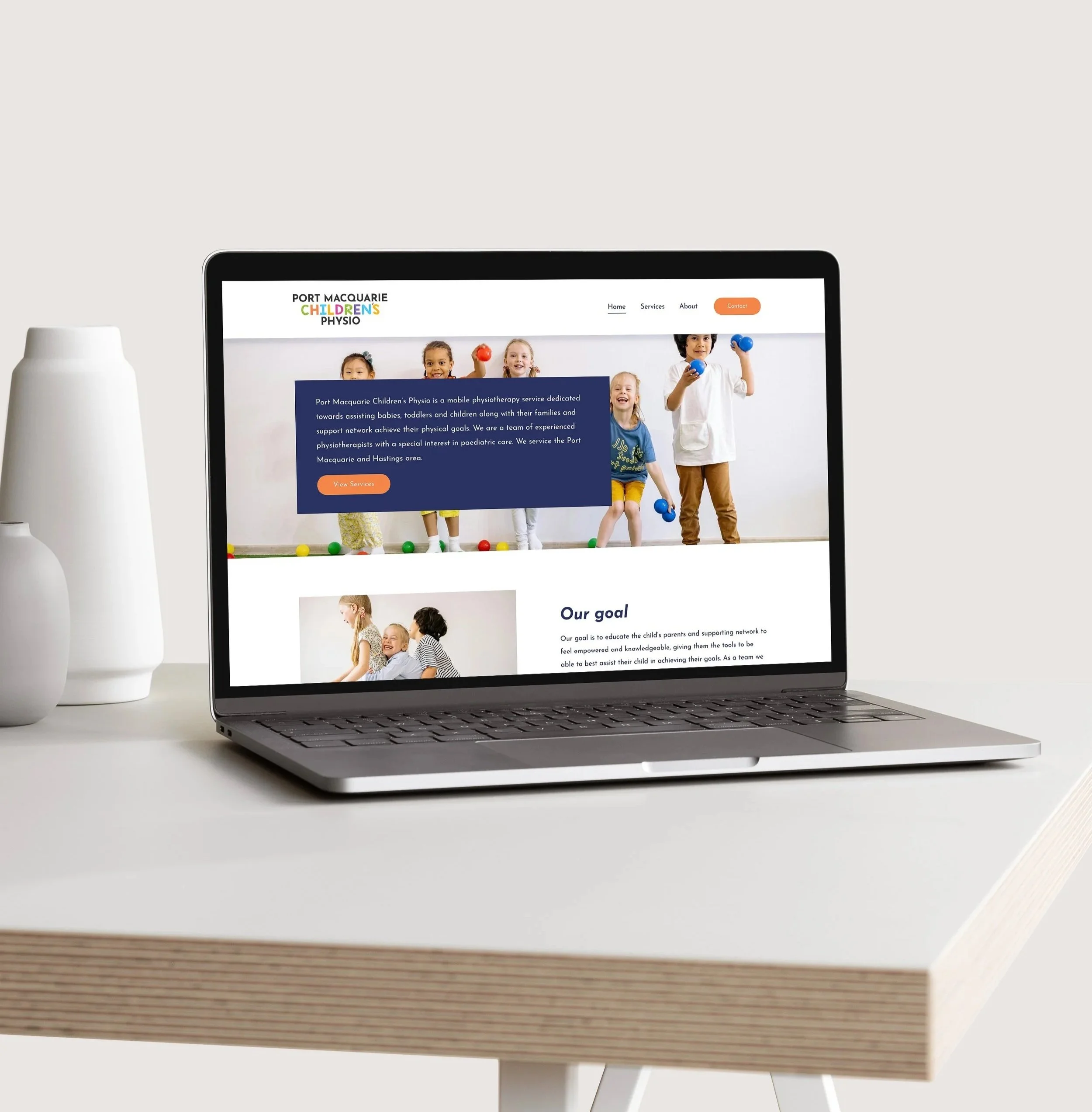 Laptop on table displaying website for Port Macquarie children’s physiotherapy clinic