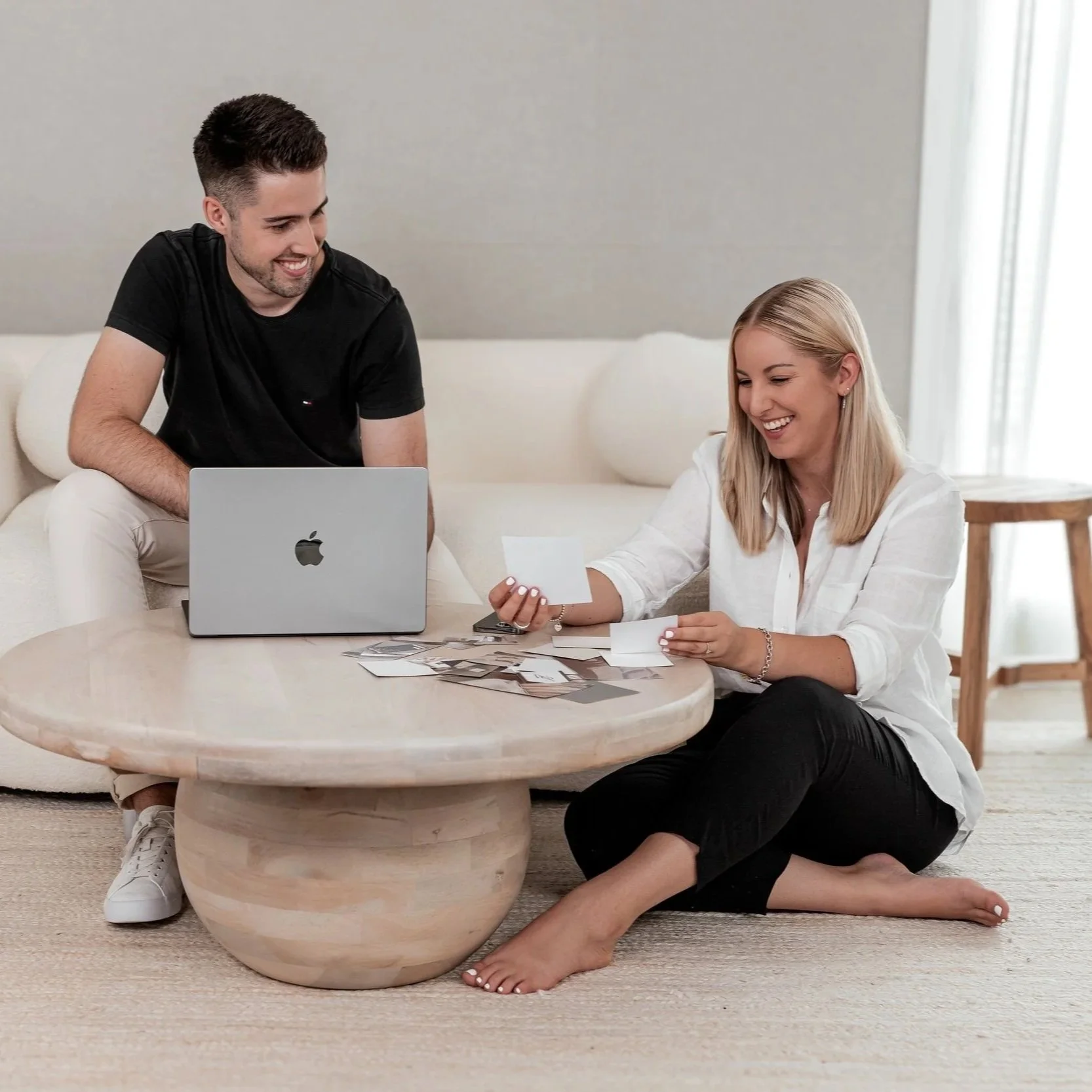 Husband and wife designers collaborating on branding and website concepts.