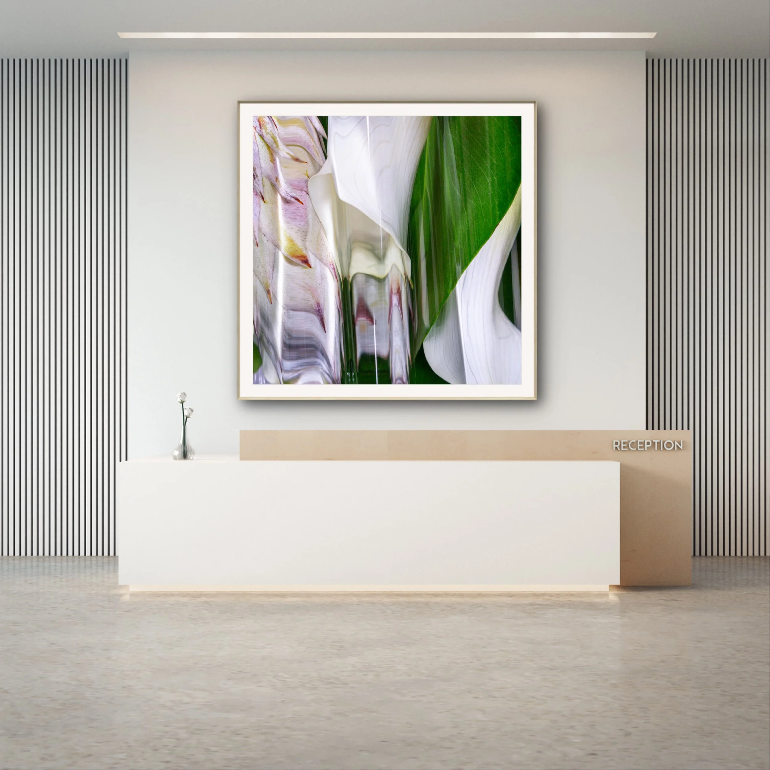A modern reception desk with a framed floral art piece on the wall behind it, a small vase with white flowers on the desk, and a sign reading 'Reception' on the front of the desk. The wall has vertical black stripes on both sides, and the ceiling has