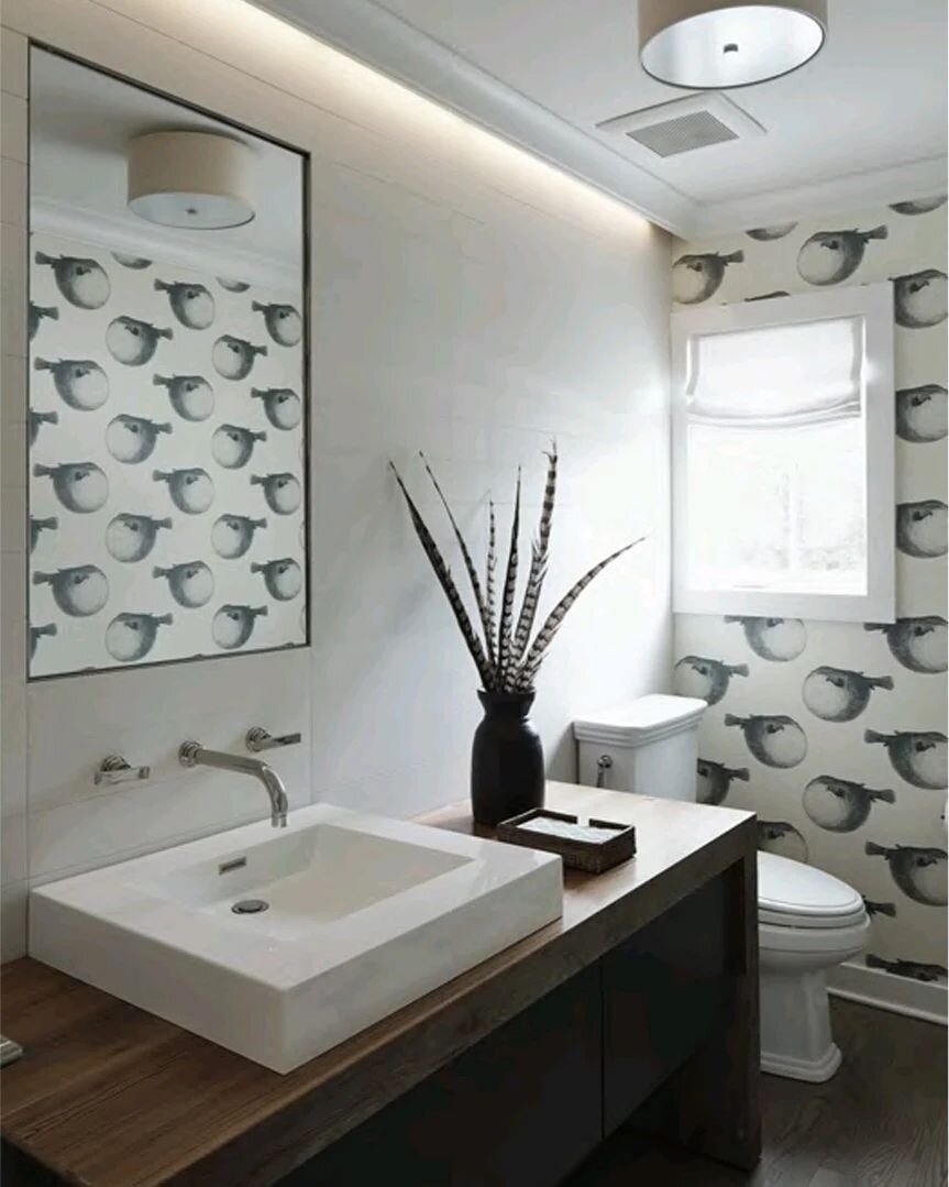 I was sitting in a meeting going through interior elevations for a remodel of a traditional home when a modern bath design popped up on our conference room monitor.  My client exclaimed &quot;l love that!  How can I have that in my traditional home?&