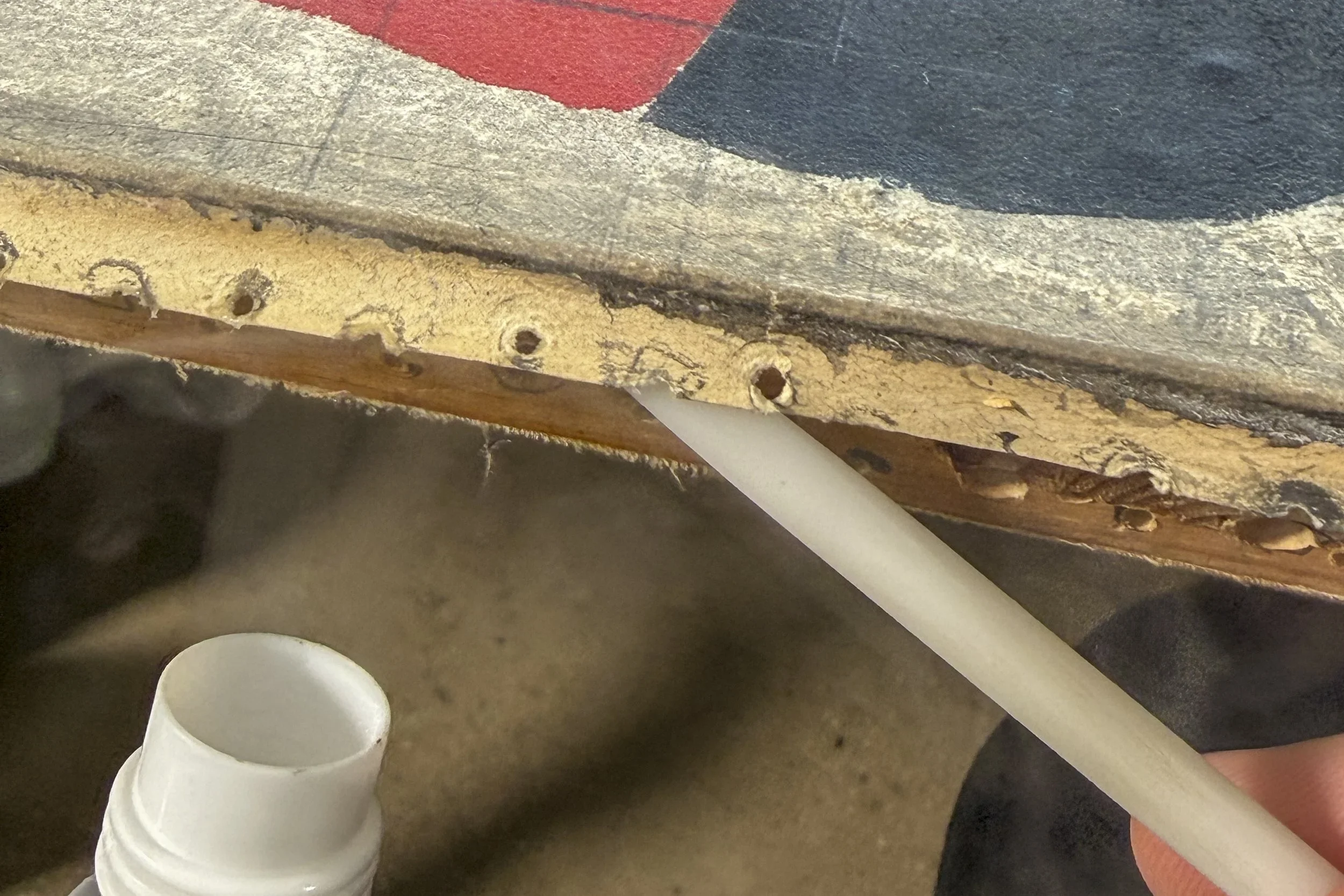 Work on paper adhered to a wooden stretcher: lifting with nebulizer and Delrin tool