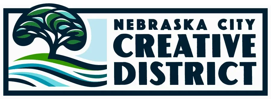 Logo for Nebraska City Creative District featuring a stylized tree and flowing lines representing nature.