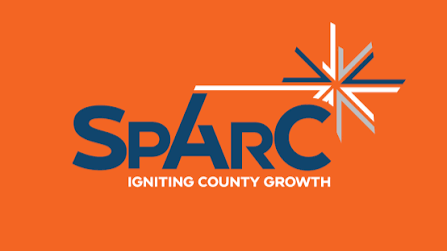 Sparc logo with tagline 'Igniting County Growth' on an orange background.