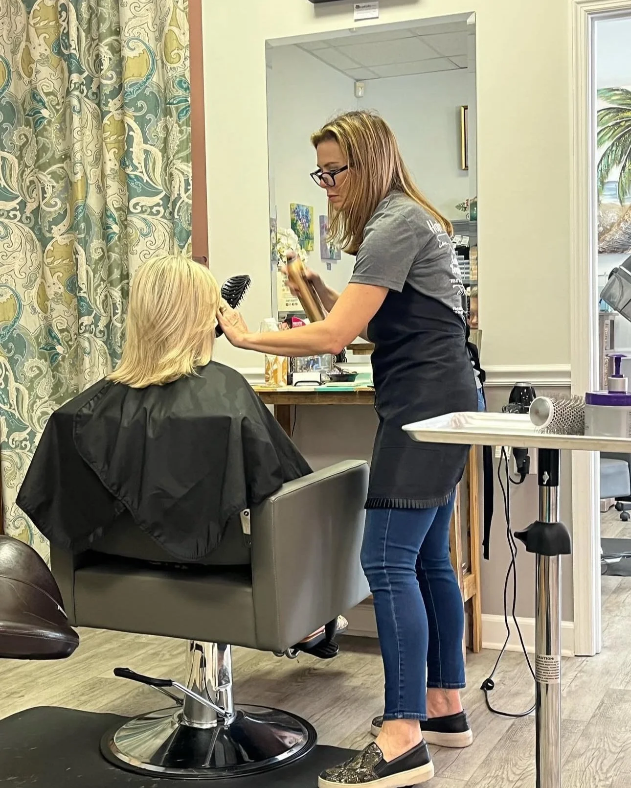 Melissa Mixon Gainey, experienced hair stylist at Hair Identity in Vero Beach FL, with 14+ years specializing in cuts and color for all ages.
