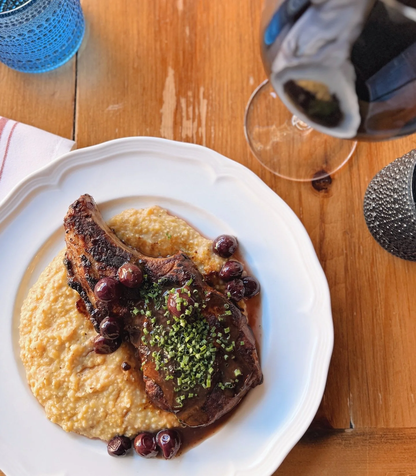 The ultimate plate on a cold day - honey-brined pork chop with plymouth grits, grape agrodolce, and thyme jus. Join us for @dineoutboston this week!
