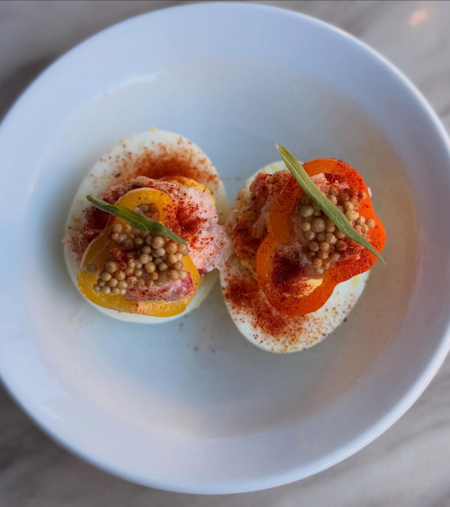 The first bite everyone orders: lobster deviled eggs. Join us for a bite and beverage at the bar tonight!