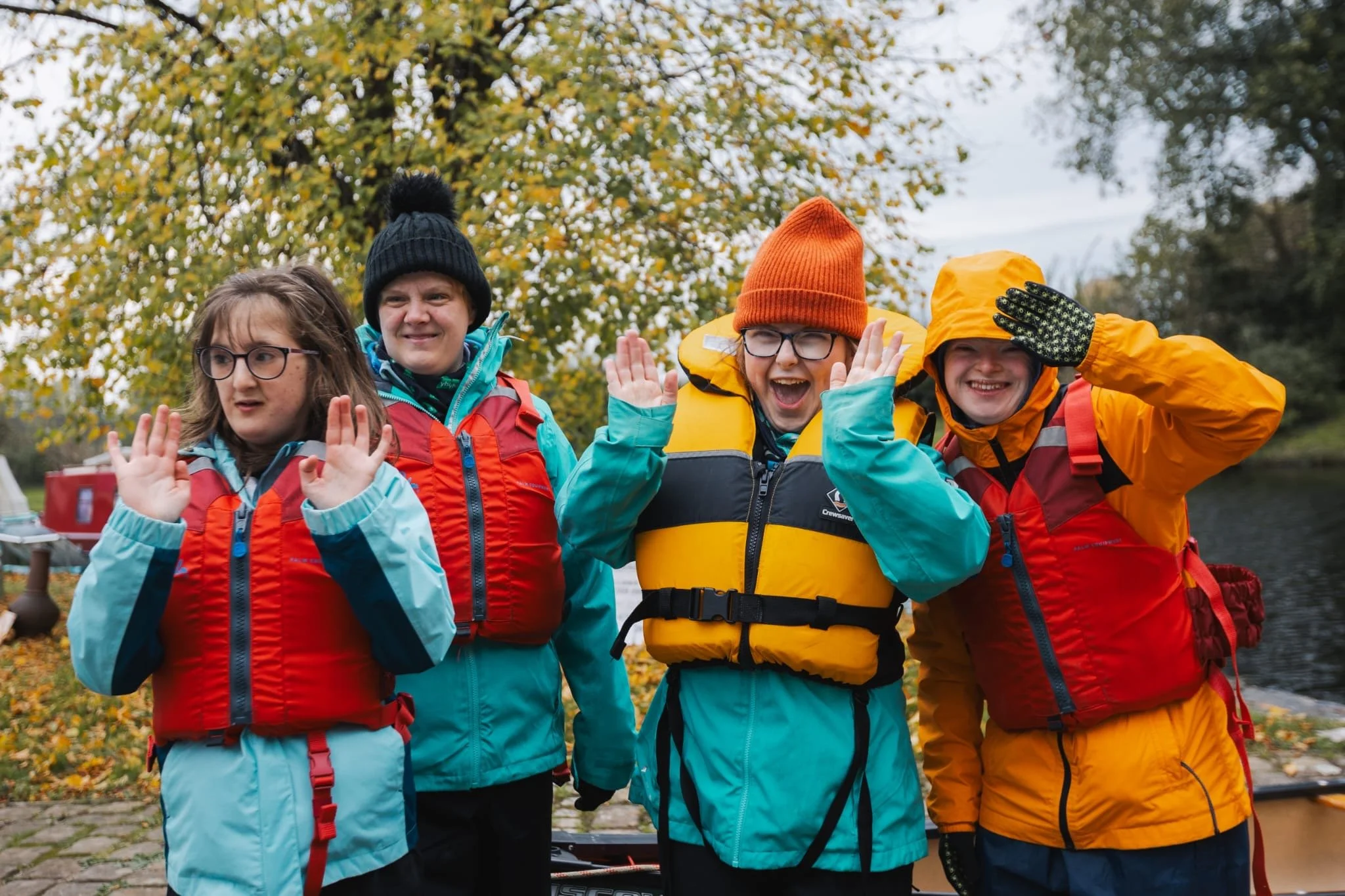 Pip and friends with wet weather jackets and pfd's on ready for a paddle adventure