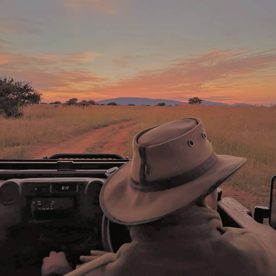 On a game drive with our ranger, looking the part. Nor just for a dazzle of zebra to gallop past and add some contrast to the landscape 🦓🌄 #sunset

#myzulustory#thetraveltribe #conscioustravel