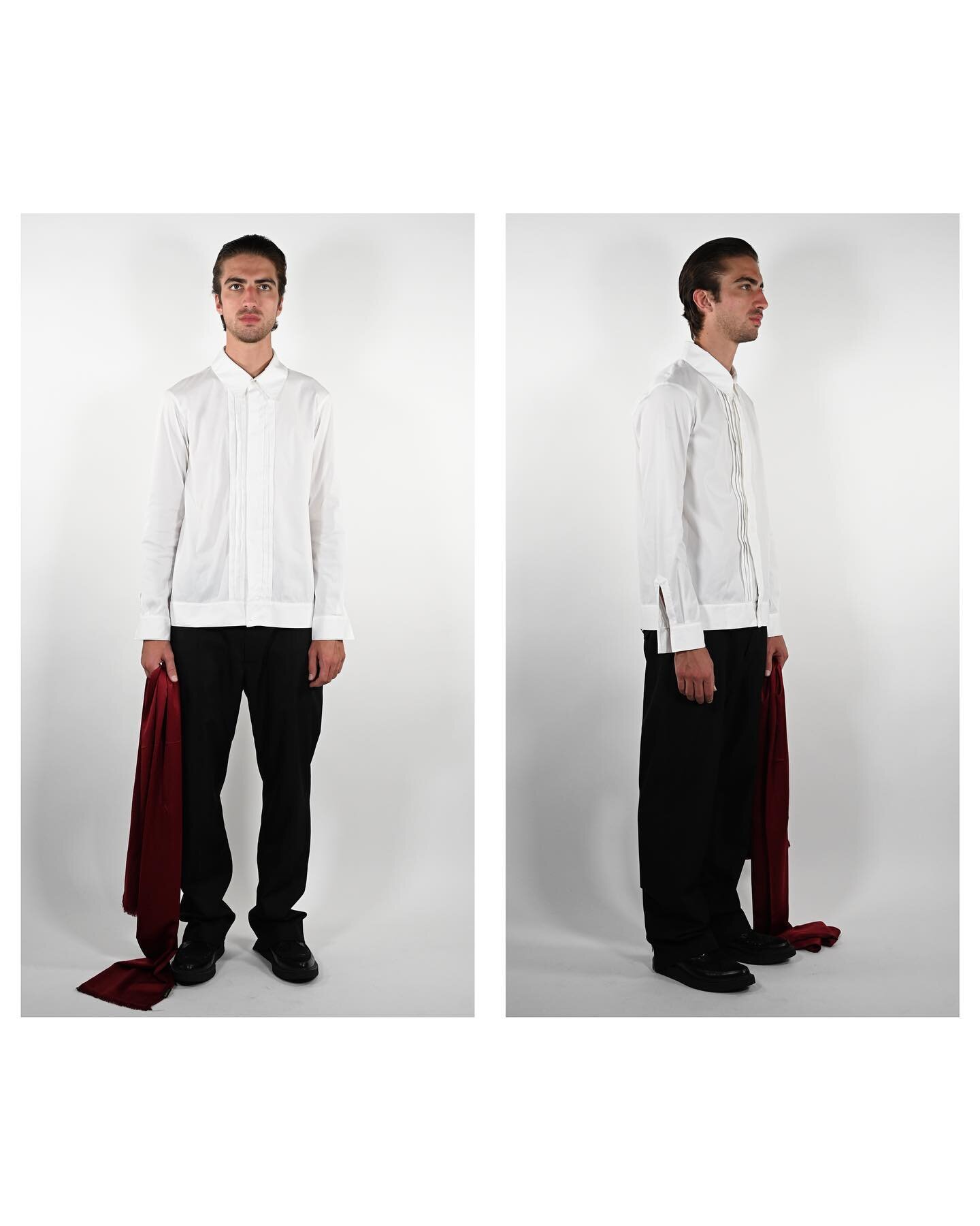 Look 2: Our White Tuxedo Shirt adorned with open-cuffs and the Back-Zip Trousers with a burgundy silk scarf sourced in Turkey. 

Photoshoot by @theo.rslt 
Modeling by @marco__signor 

Mens Spring/Summer 2023 collection available for viewing via evren