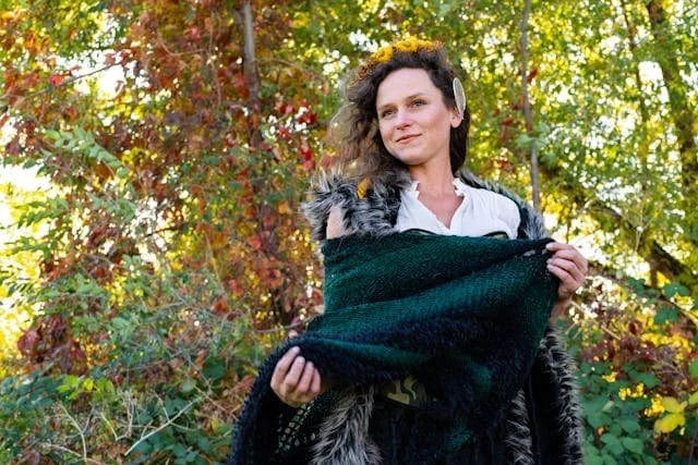 a smiling woman outside