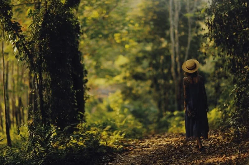 A woman walking in the forest