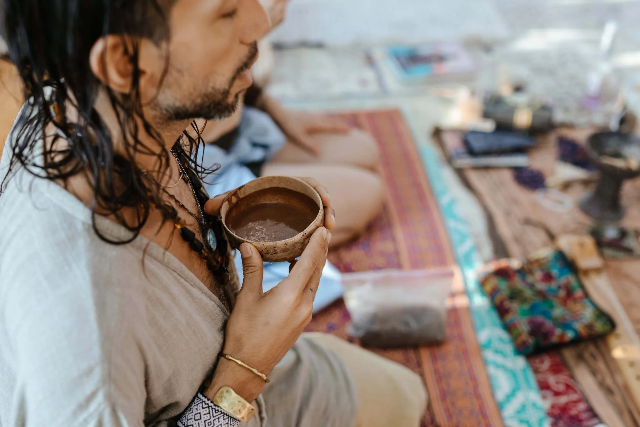 Toltec Medicine Man facilitating a cacao prayer and connecting with the medicine in a cacao ceremony