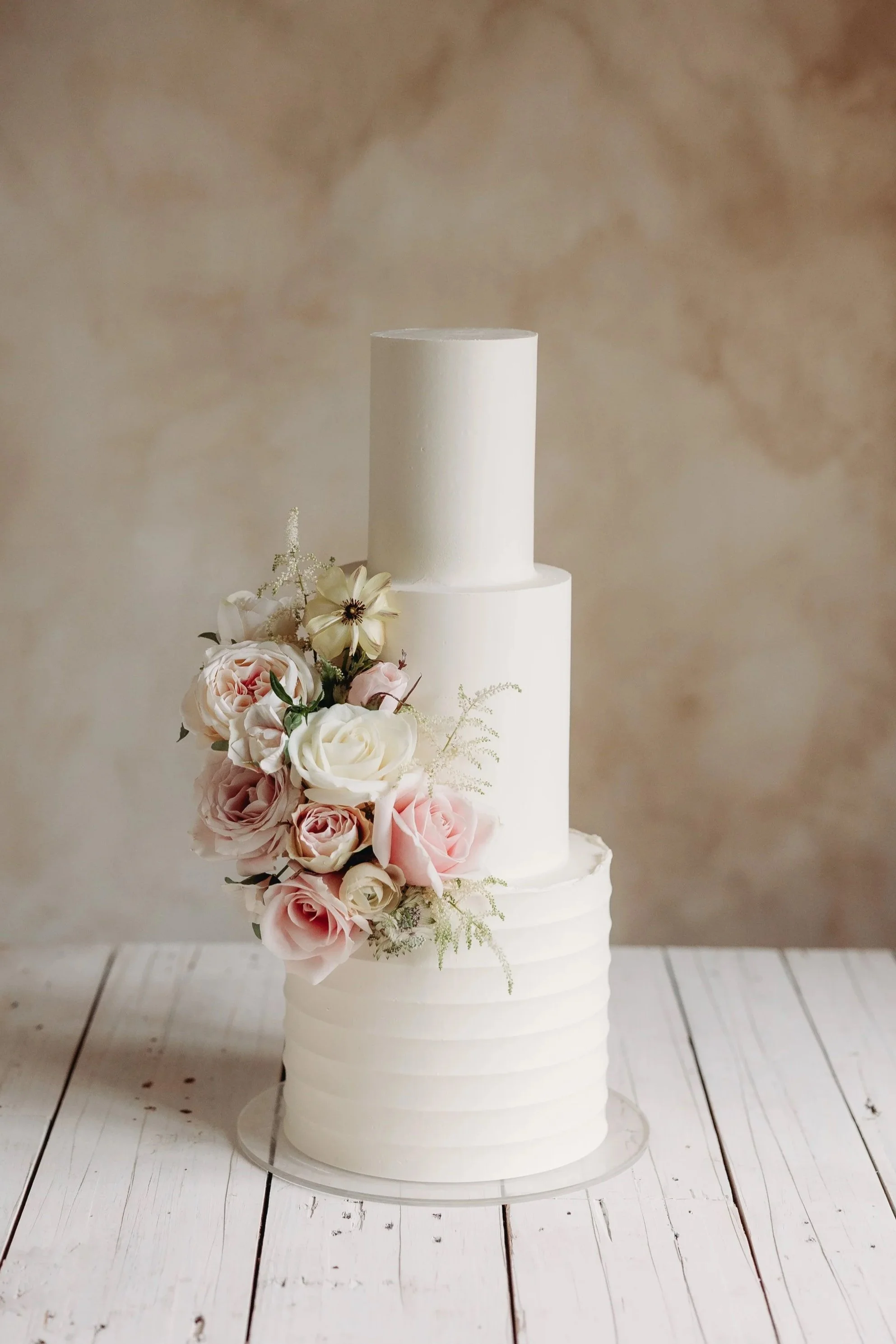 White Cambridge Wedding Cake with fresh flowers