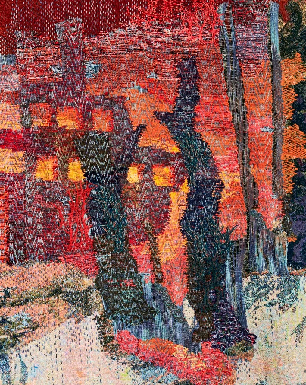 Colorful embroidery art depicting a forest scene with trees and a person walking among them. Maris Van Vlack.