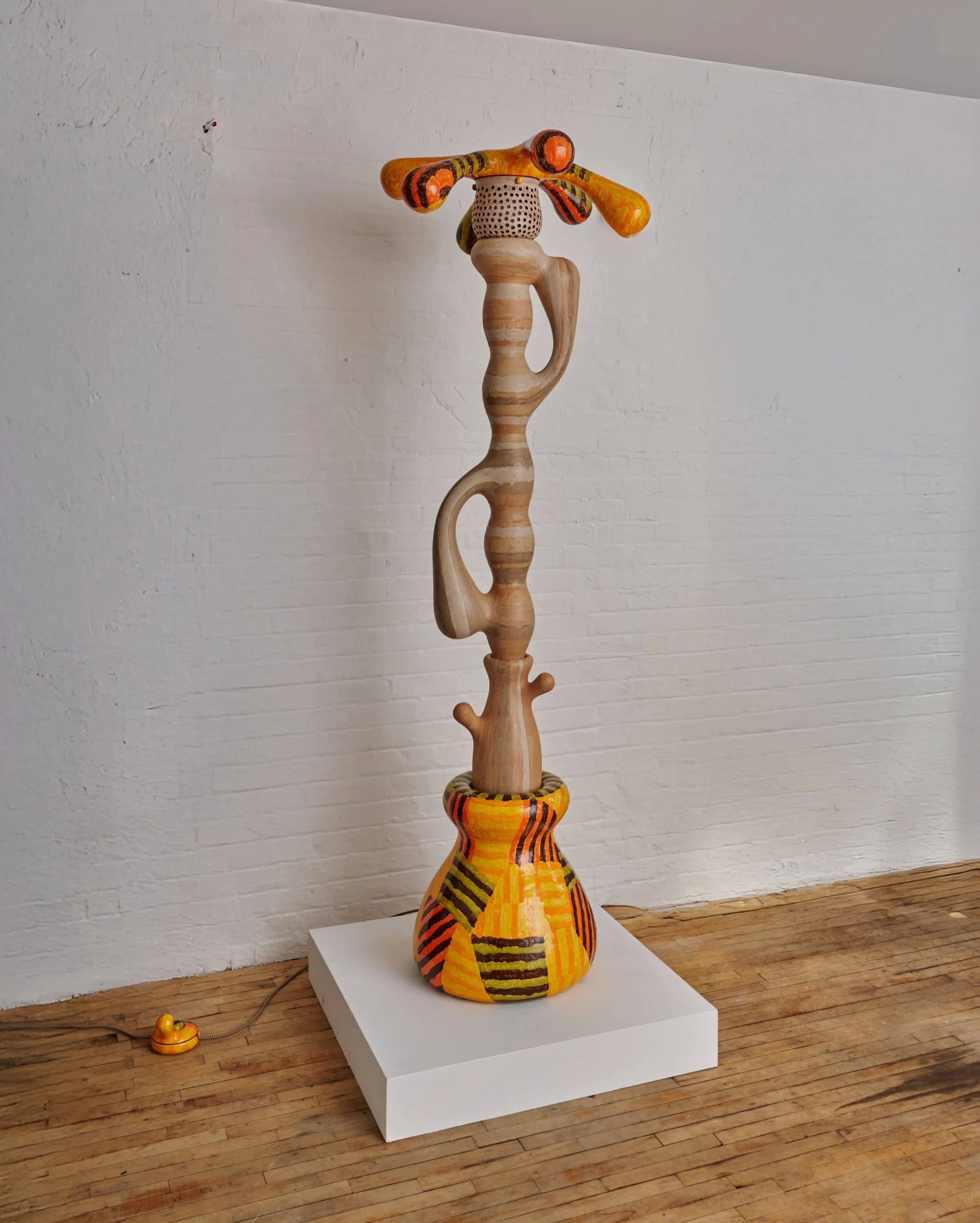 A colorful abstract sculpture in a gallery space. Joël Brodovsky-Adams.