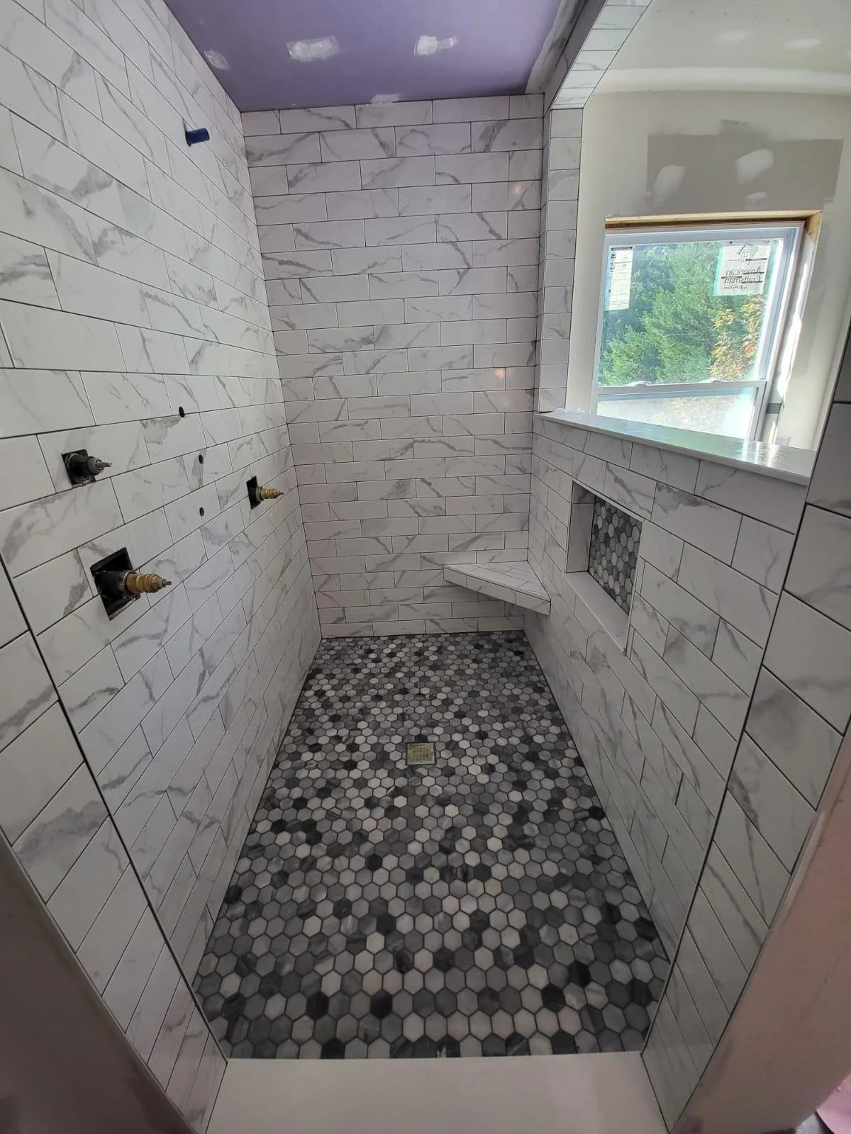 shower bathroom renovation_remodel_shower bench_tile_backsplash_flooring.jpeg
