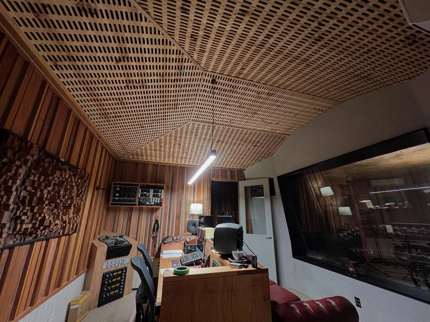 Control room acoustic upgrades @ziggy_tone.  We replaced the entire ceiling with a full ceiling acoustic treatment.  Multiple membrane absorbers custom tuned to different frequencies and broadband polyester absorbent behind our slotted lining board. 