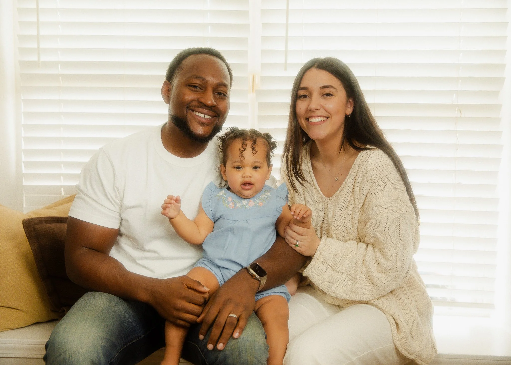 Family photo of Mom, Dad, and daughter