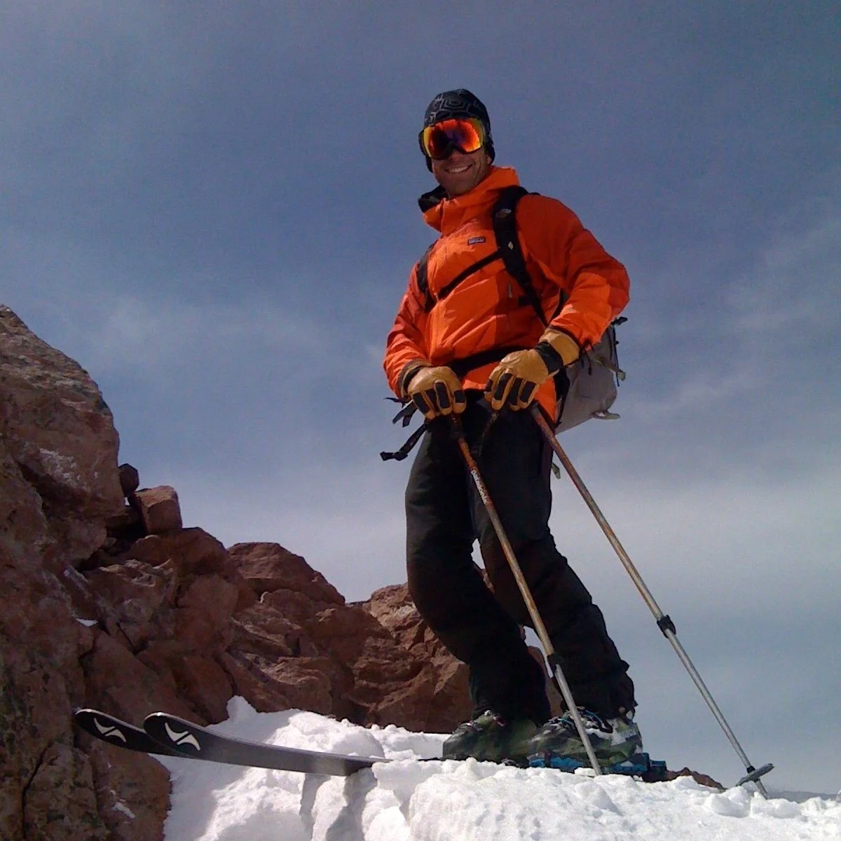 Chris Carr ski mountaineering on the summit of Shastina, high Cascade volcano, ready to drop in