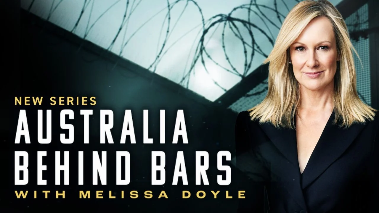 Promotional poster for a series titled 'Australia Behind Bars' with Melissa Doyle. The background shows a prison exterior with barbed wire, and there is a woman with blonde hair in a black suit smiling at the camera.