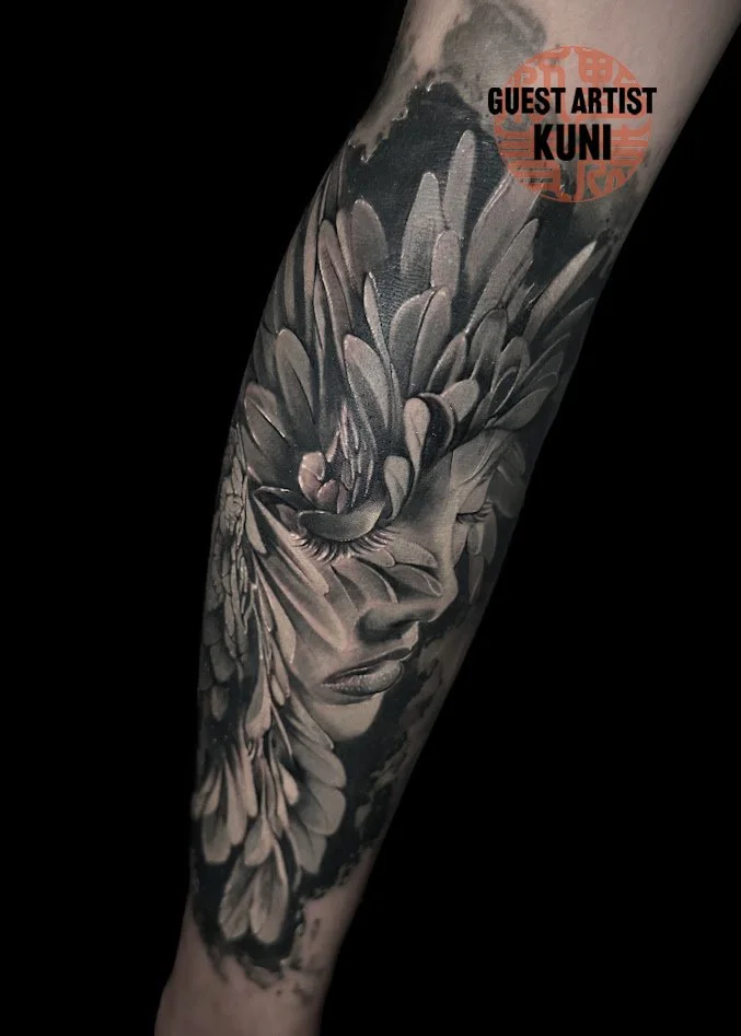 Black and gray realistic tattoo by Kuni