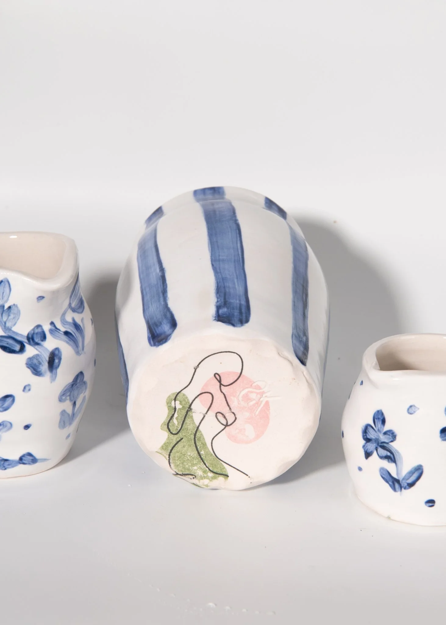 Handmade Blue Striped Porcelain Vase Bottom view with sketch of woman