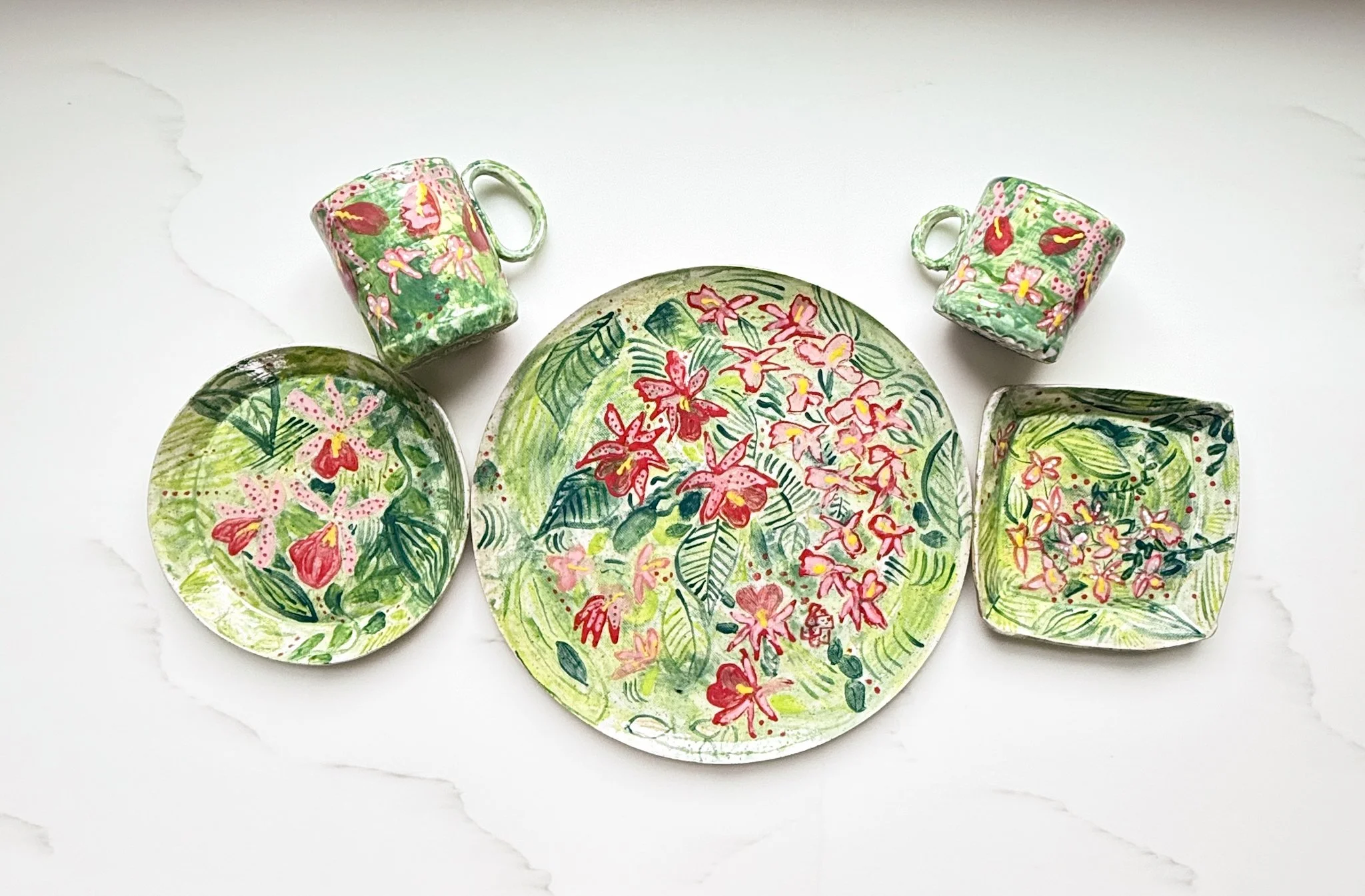 Assorted Plates and Mugs of Tropical Orchid Design