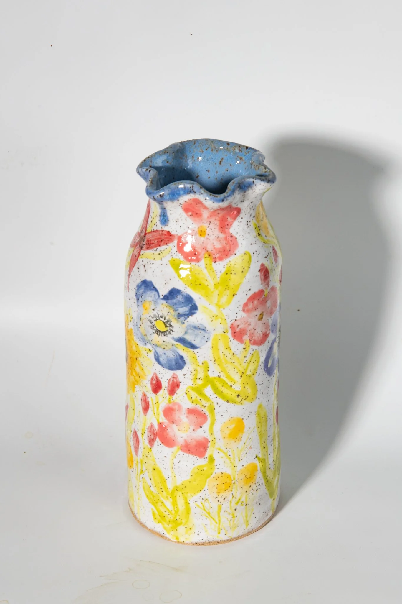 handmade ceramic vase with sunflowers, poppies and other flowers