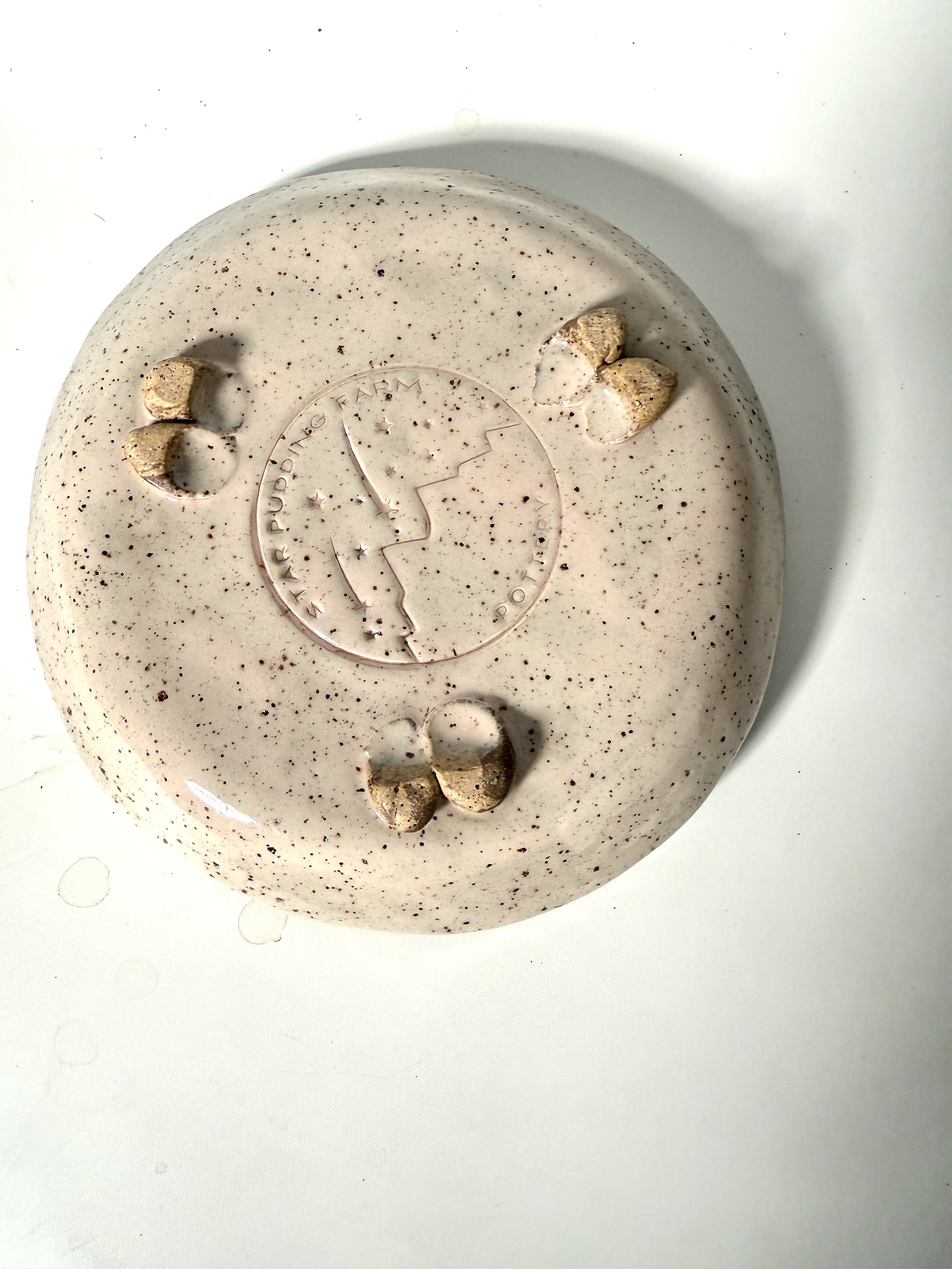 View of the Handmade Ceramic Saucer bottom surface that is footed