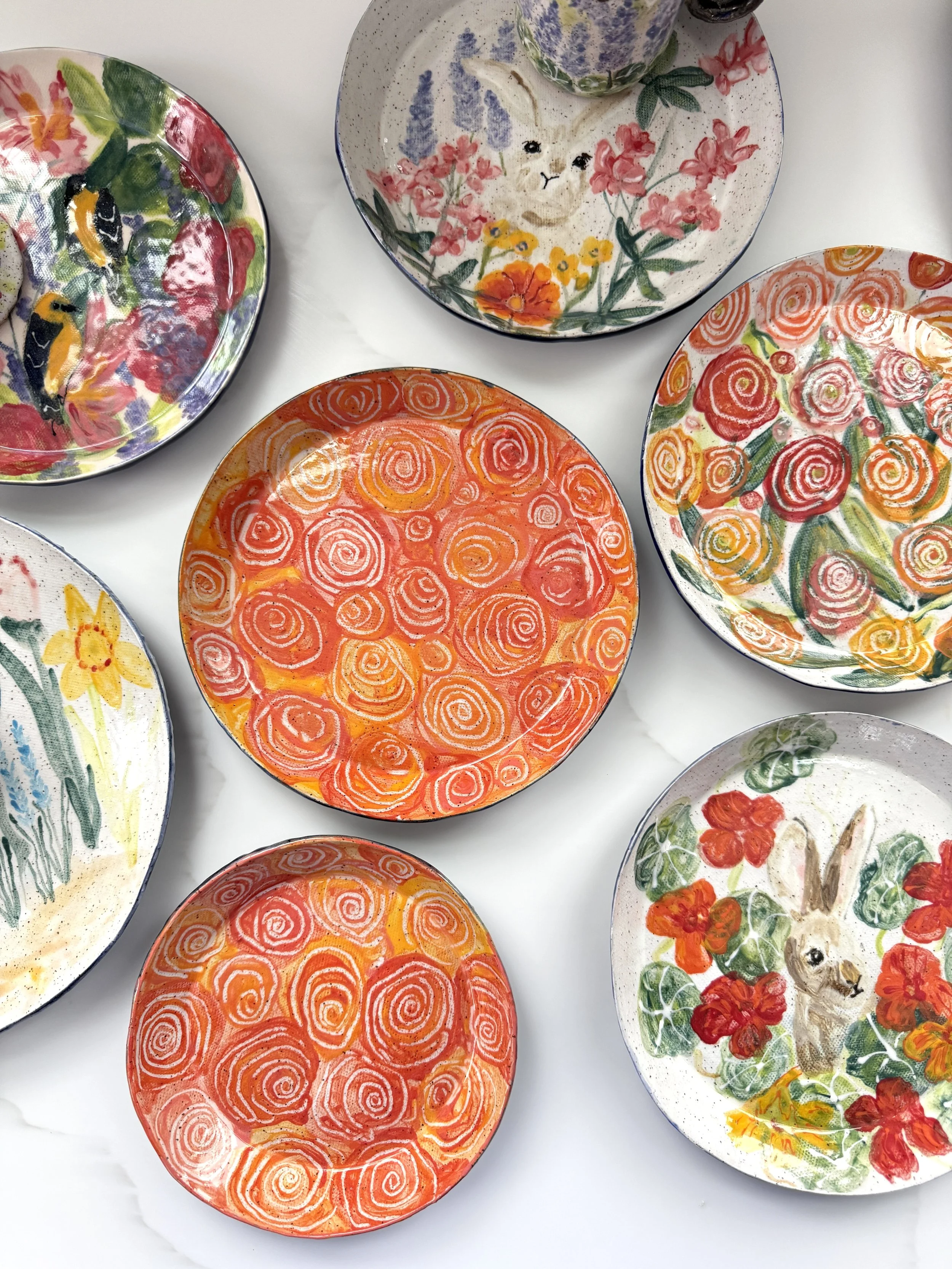 Group of Plates with Orange Abstract fFower Plates