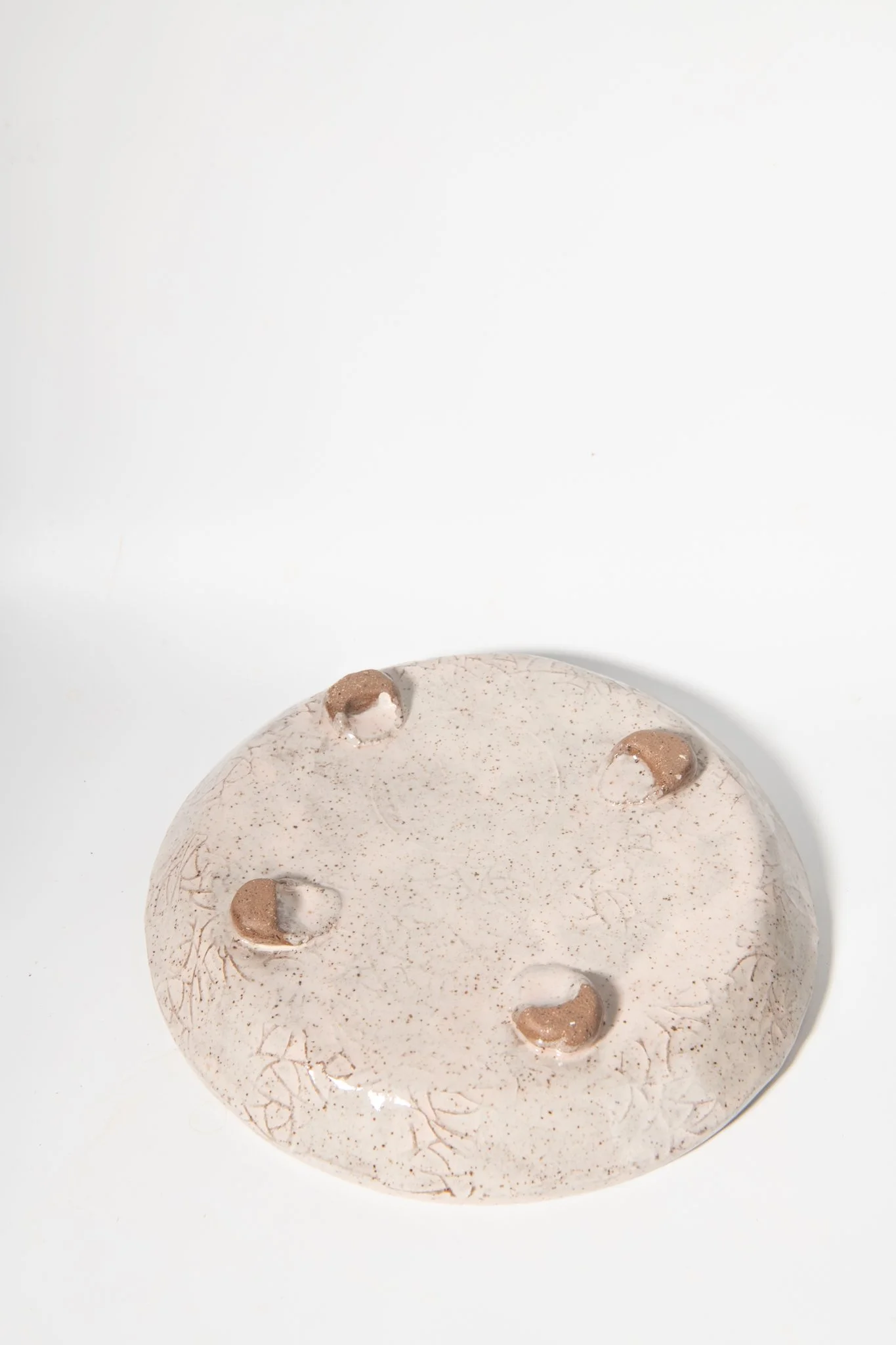 Back side of Handmade Ceramic Footed Dessert Palte