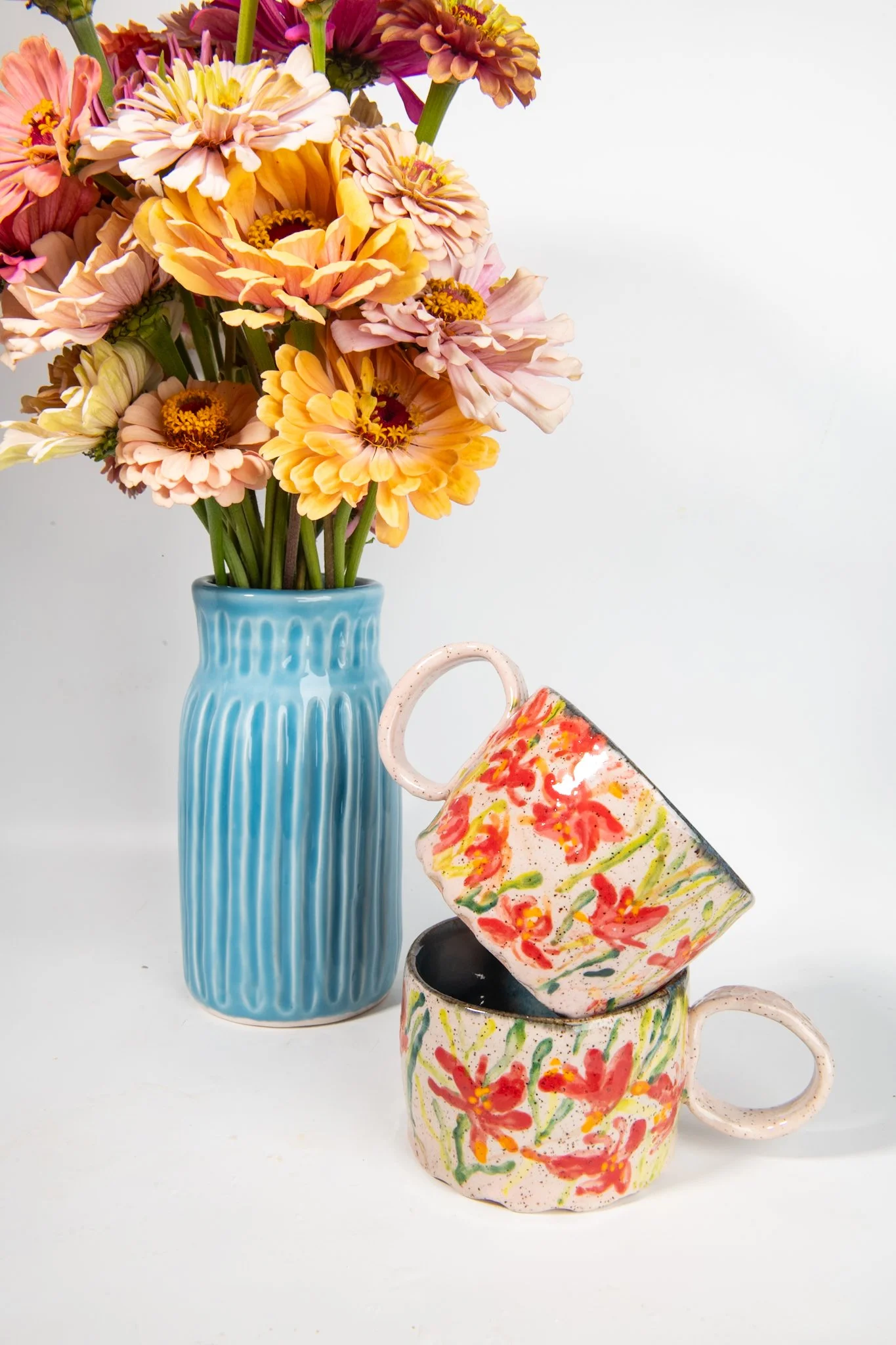 Image of Tropical Orchid Saucers with matching Mugs resting on them