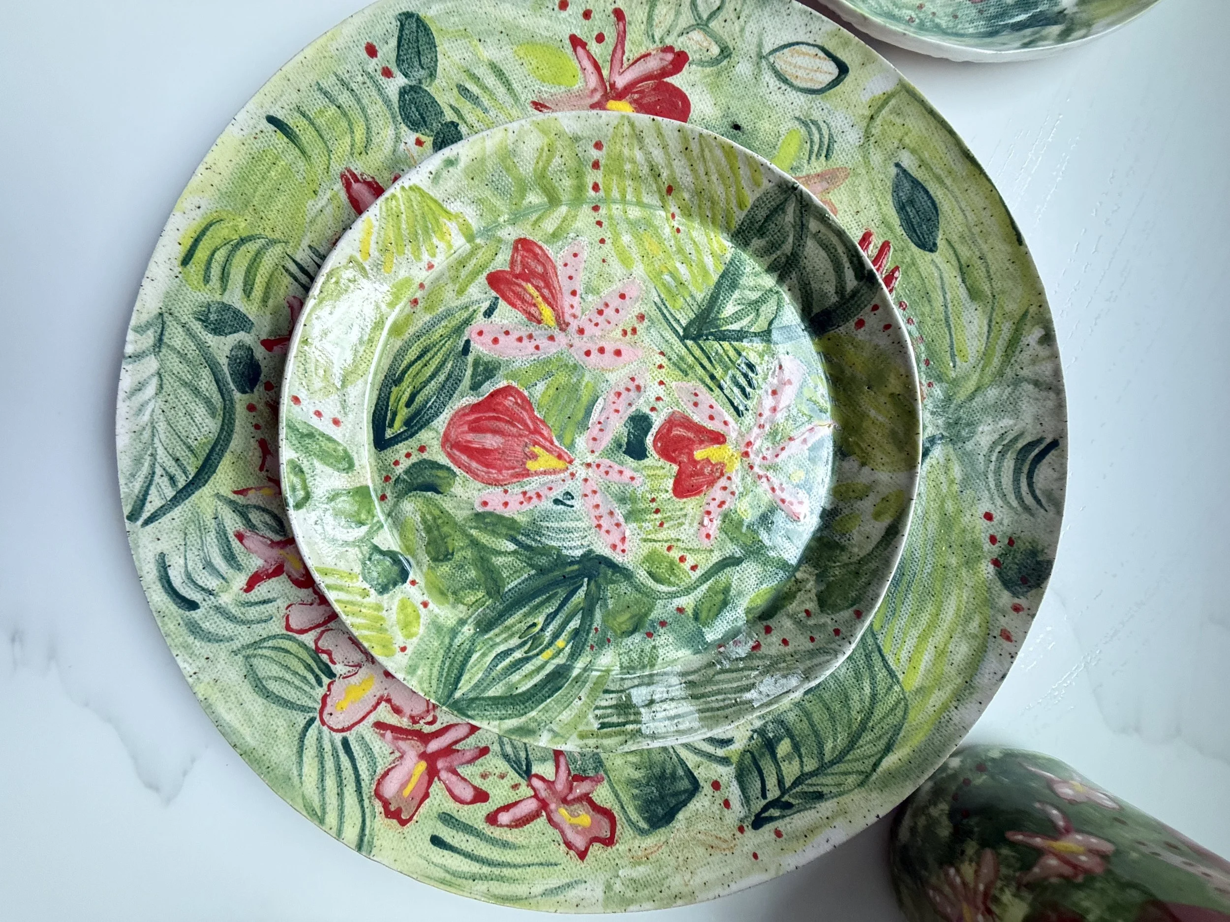 Tropical Orchid Round Dessert Plate sitting on Dinner Plate