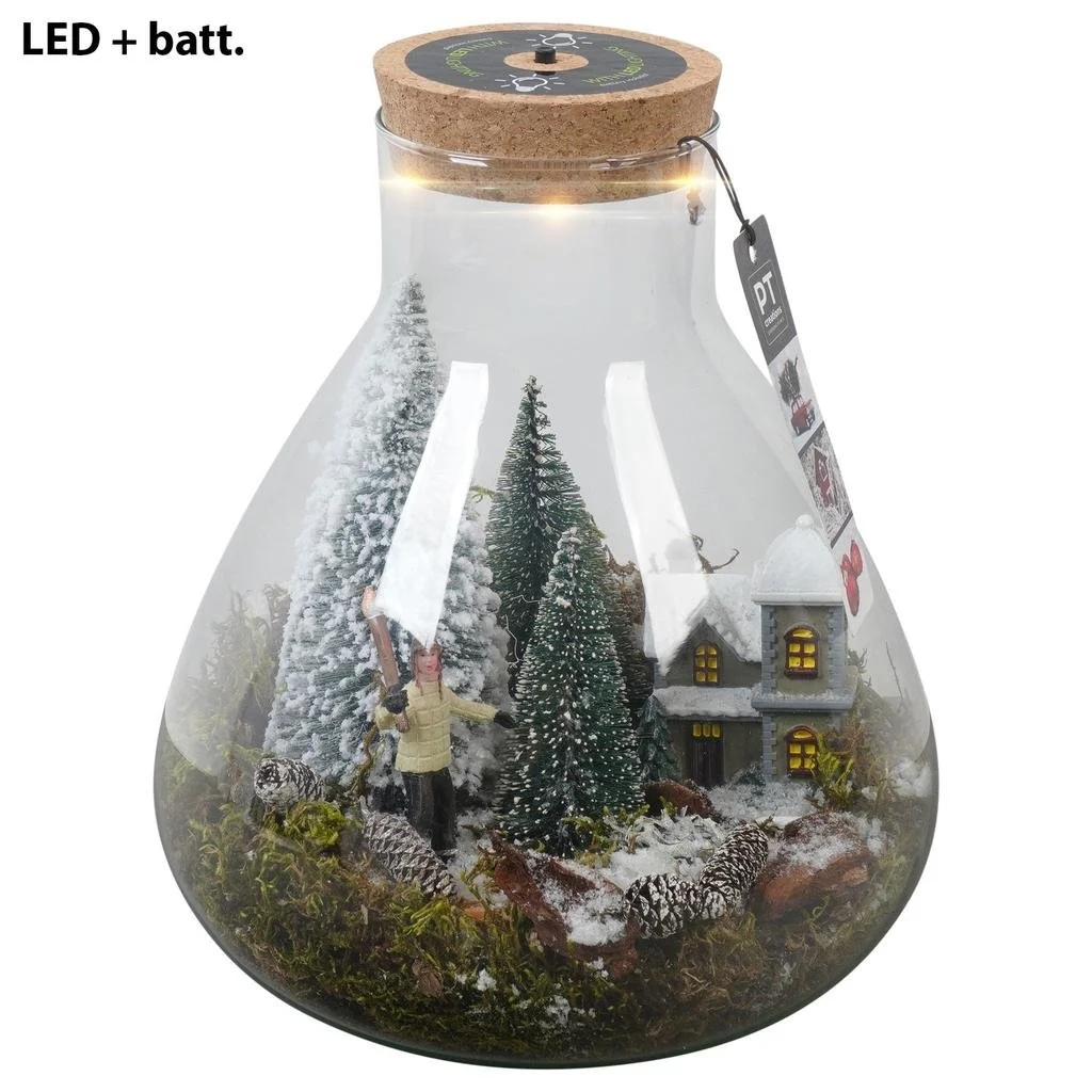 Christmas Village arrangement in glass terrarium