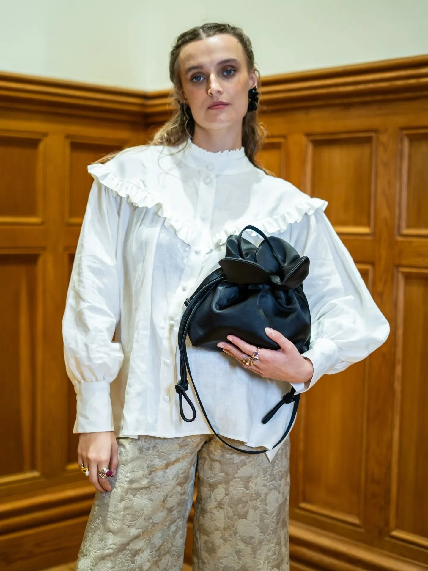 The Petal Cinch bag in black satin from AW25
Image @kayleigh_carlin 
Top @jenniferslatterytextiles 
Mua @dbmakeupartist_ 
Hair @nathanwade234
Model @acamodels