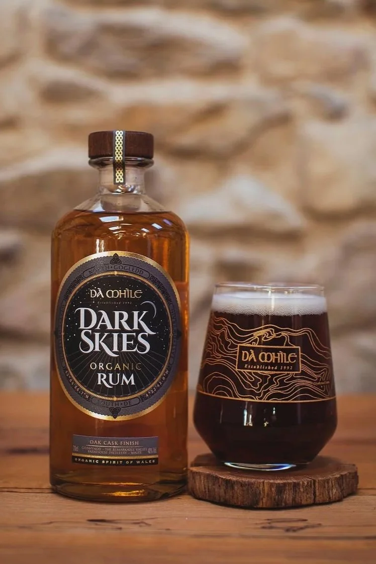 DaMhile Dark SKies Rum and glass of rum and coke in branded tumbler