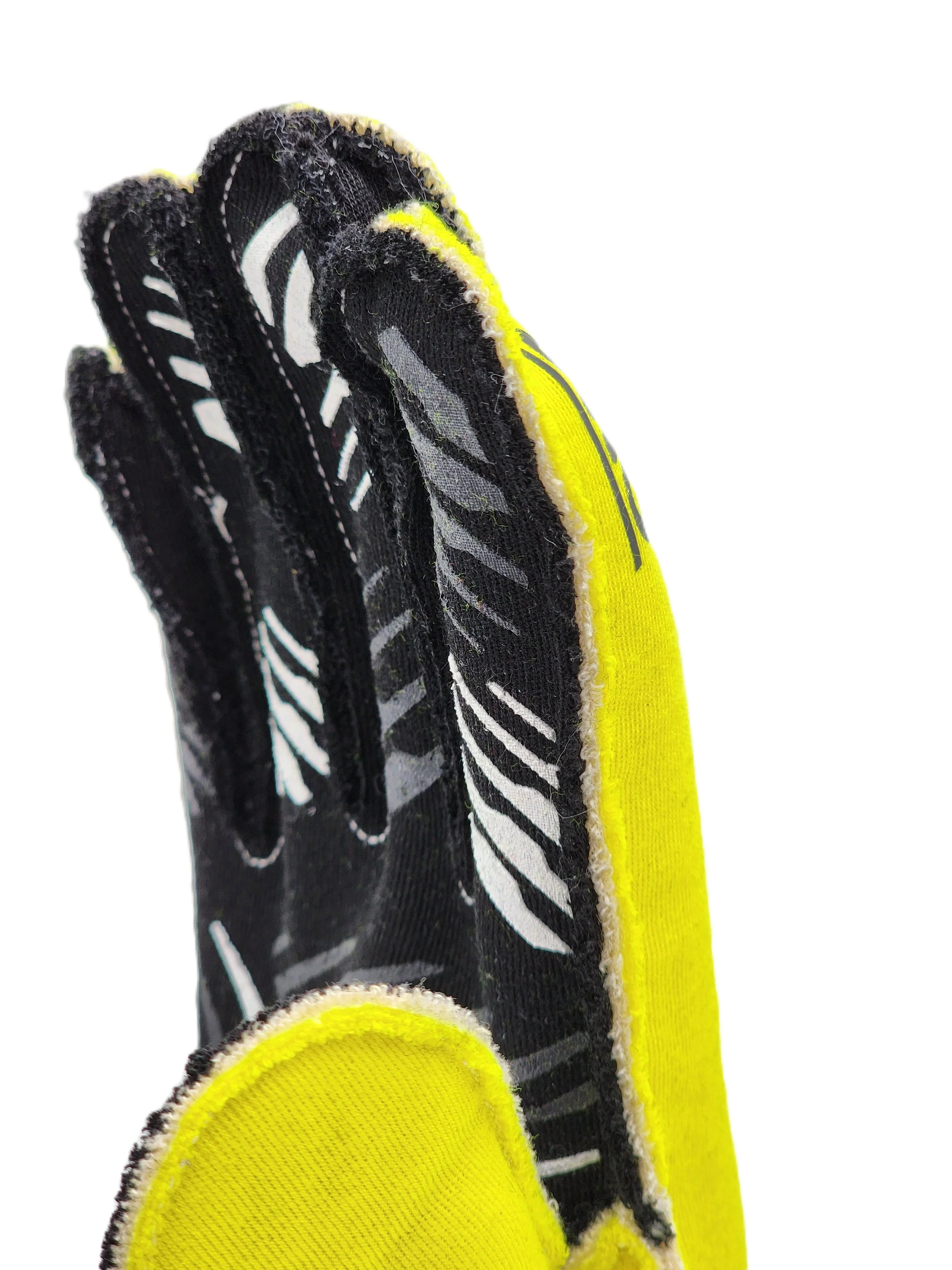 The finger detail from an auto racing glove. The details illustrates the outside seam feature.