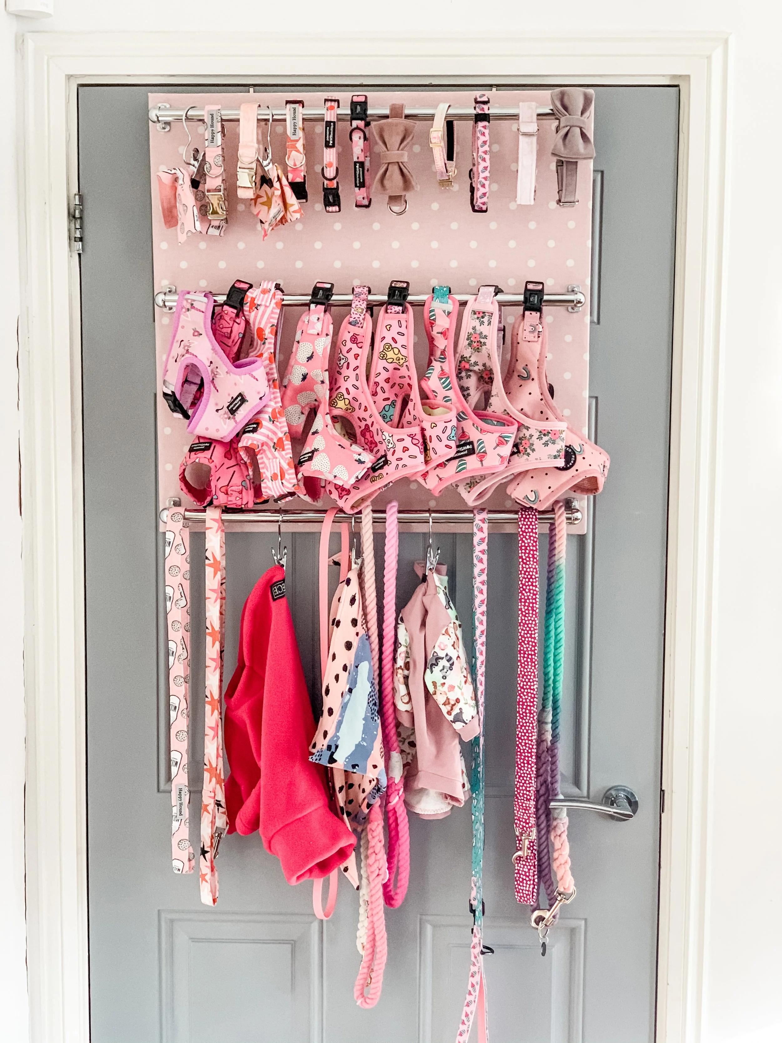 Pupdrobe hanging over door in Pink Spotty finish with matching leads