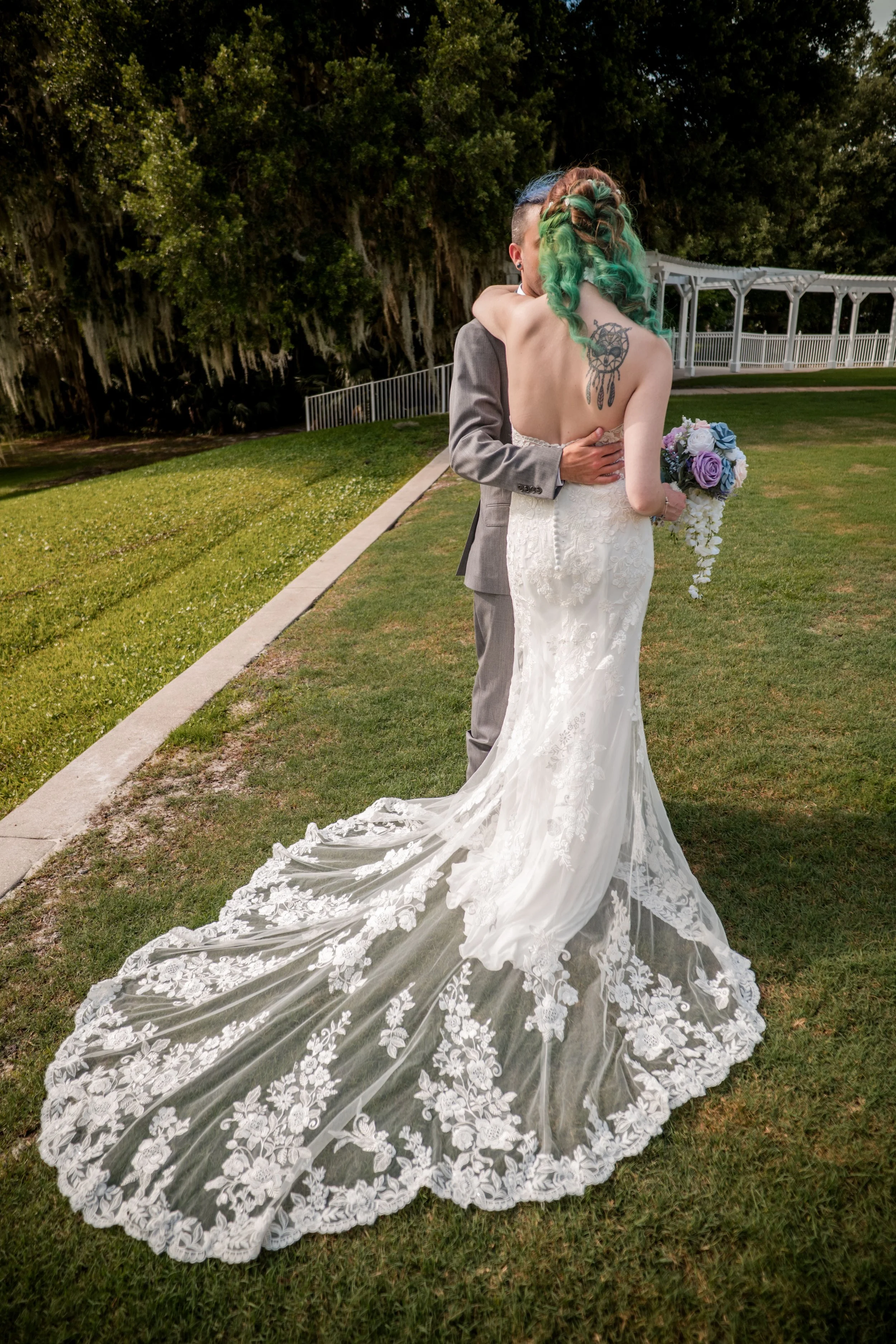 Lydia and Josh on their wedding day at Lake Mary Events Center in Lake Mary, Florida, featuring a Sincerity Bridal wedding gown from Enchanted Bride.