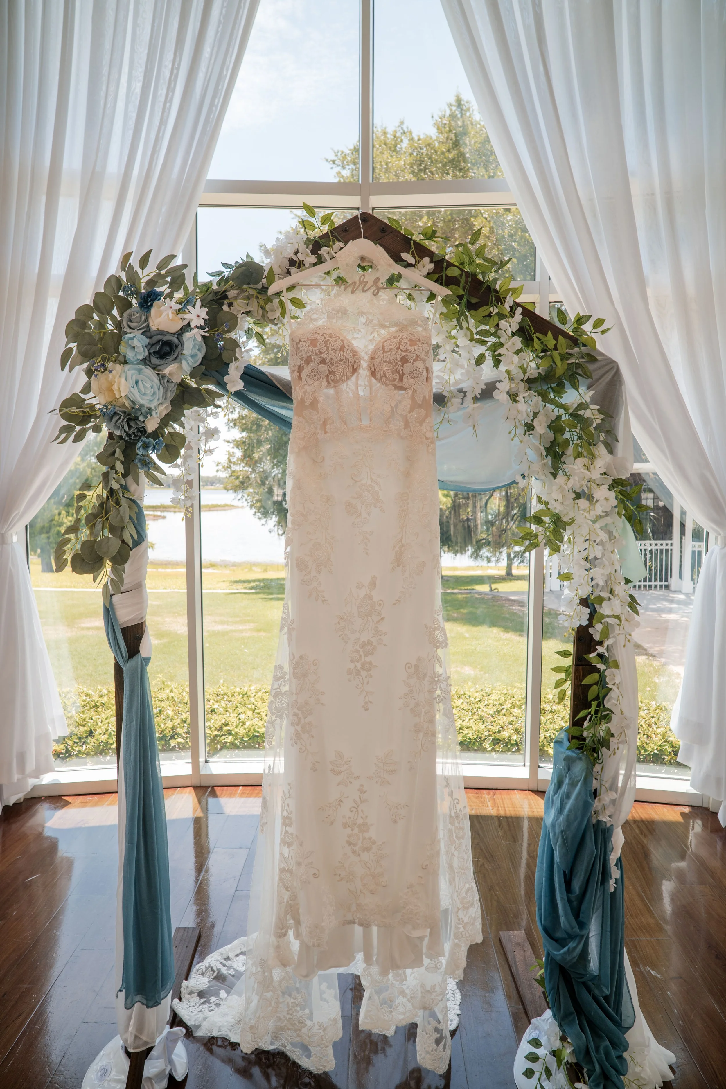 Lydia and Josh on their wedding day at Lake Mary Events Center in Lake Mary, Florida, featuring a Sincerity Bridal wedding gown from Enchanted Bride.